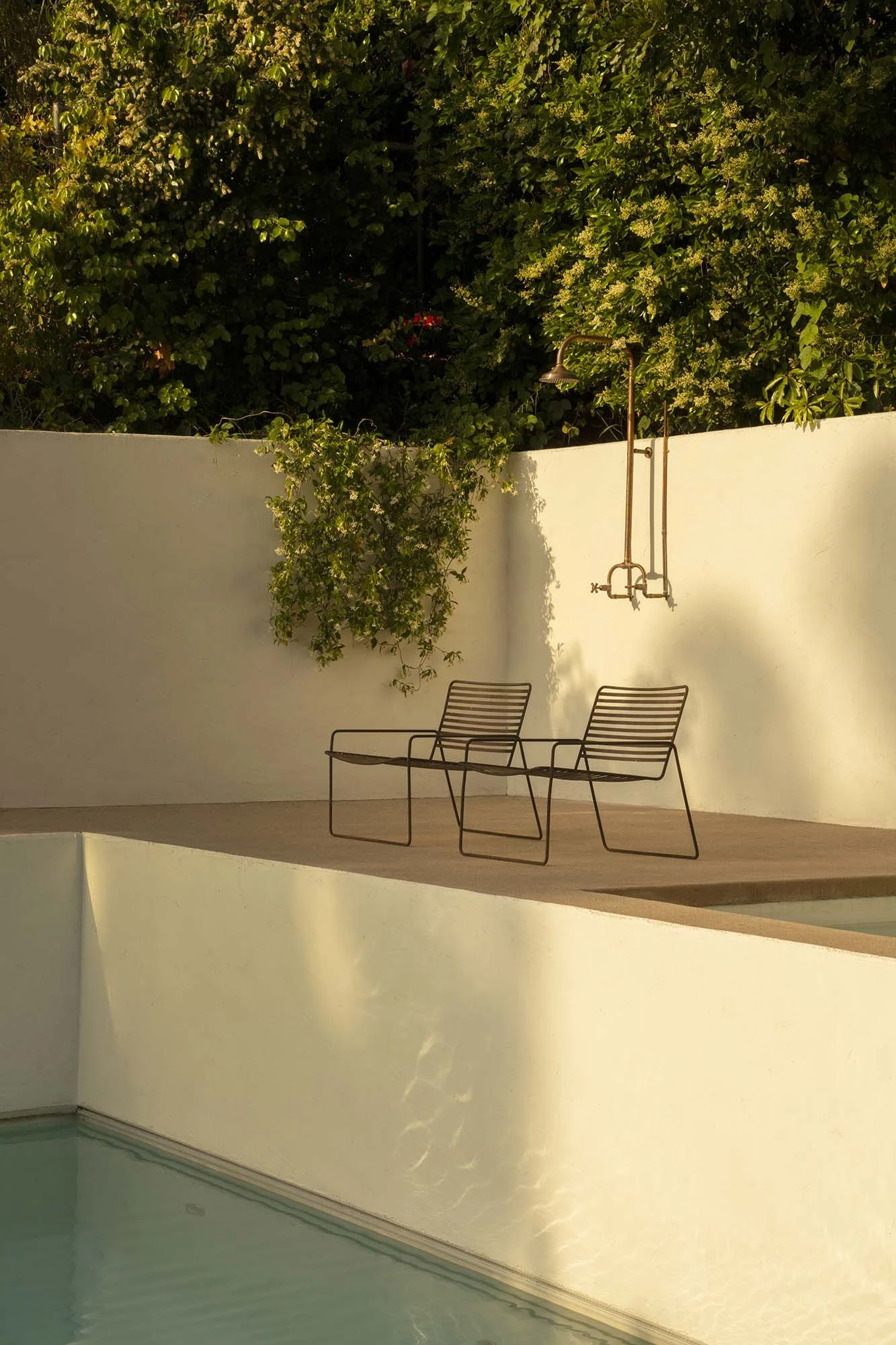 PL6014-048-pool-deck-lounge-chairs-outdoor-shower-dusk.jpg