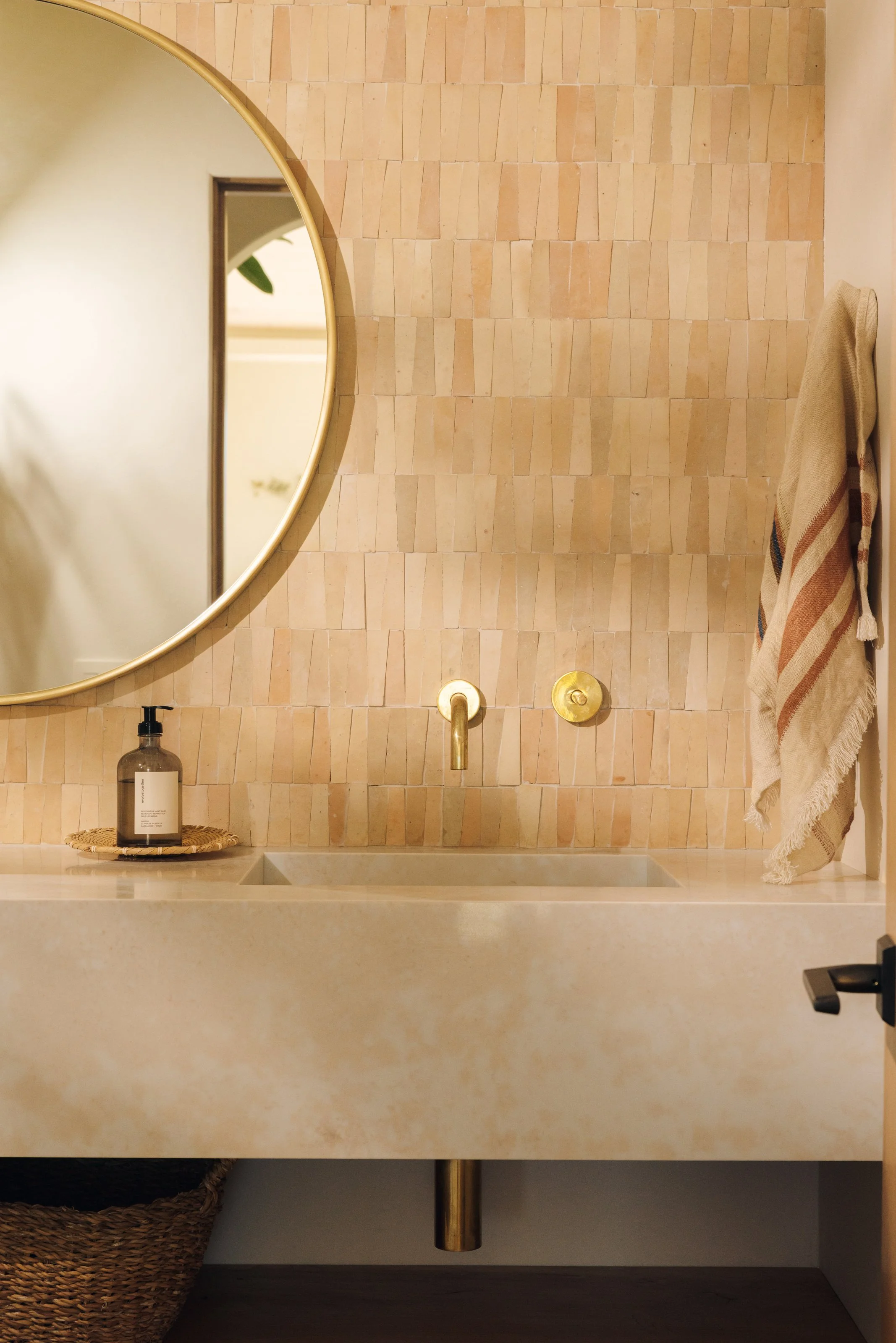 Powder room with tile wall and floating vanity