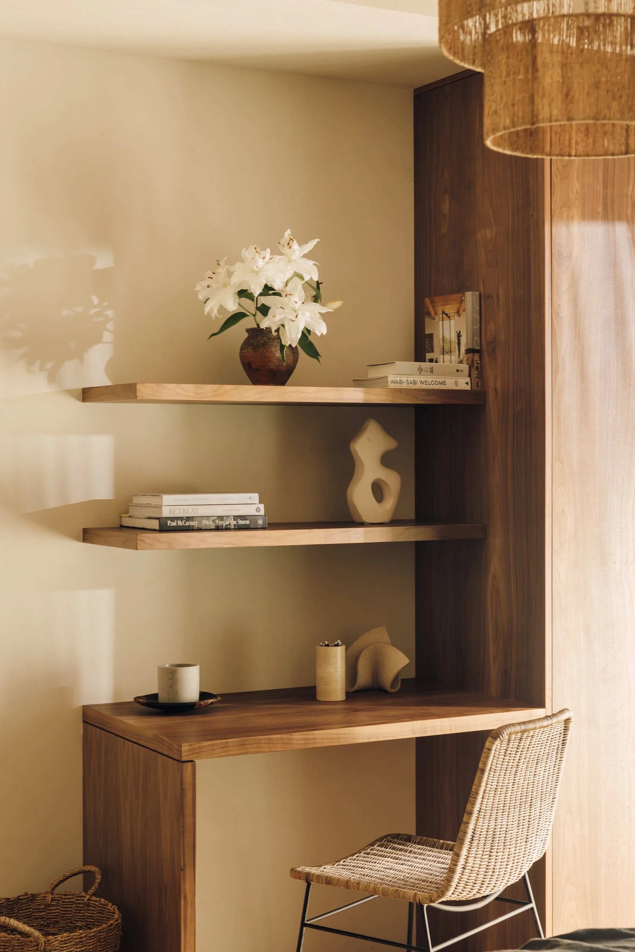 Study nook with wood desk and floating shelves
