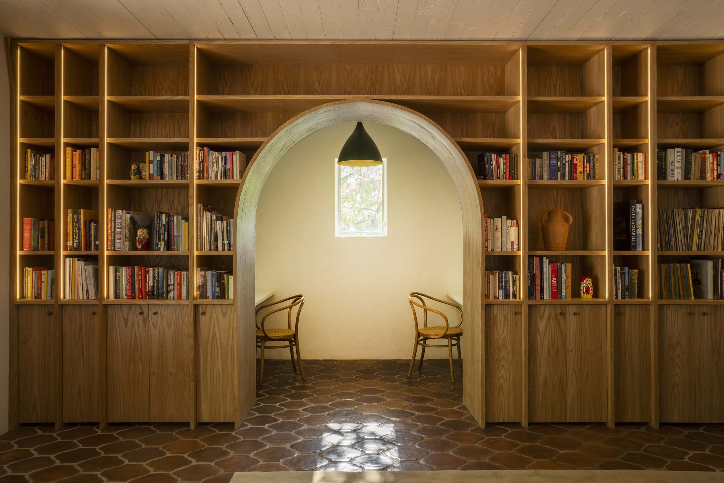 PL6014-018-library-arched-bookshelves-hex-tile-bentwood-chairs.jpg