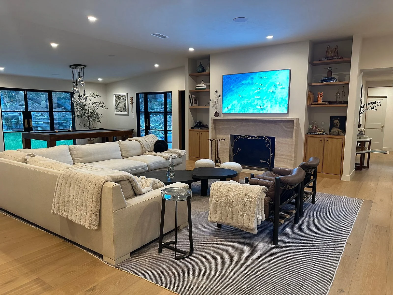 Family room with fireplace, garden access and warm wood floors. | PL-3803
