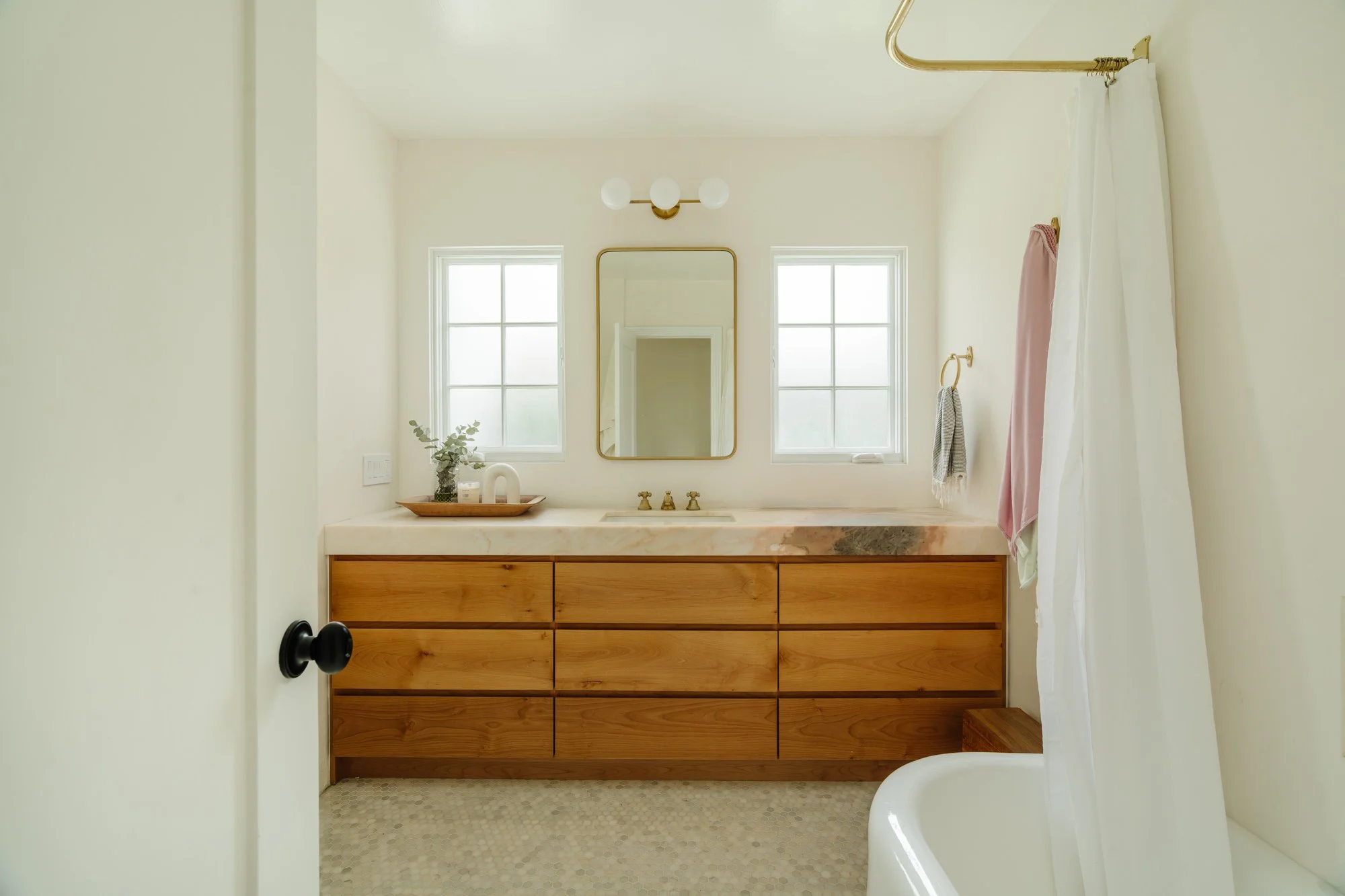Bathroom — wood vanity and stone countertop