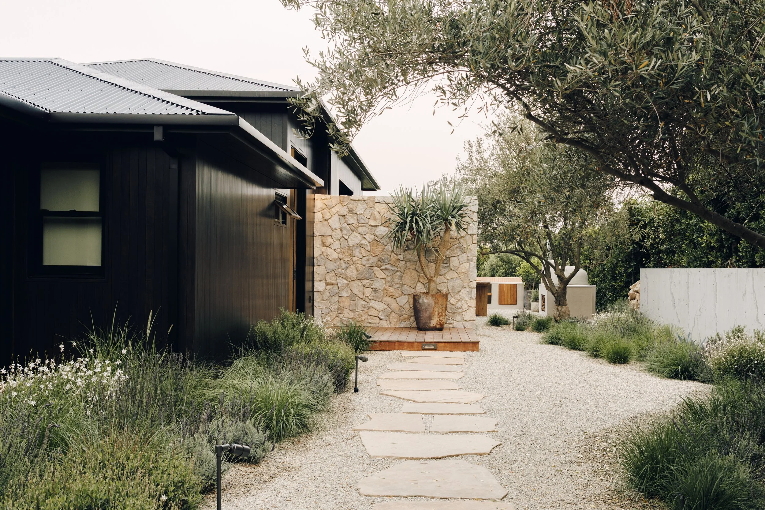Garden entry path and dark exterior