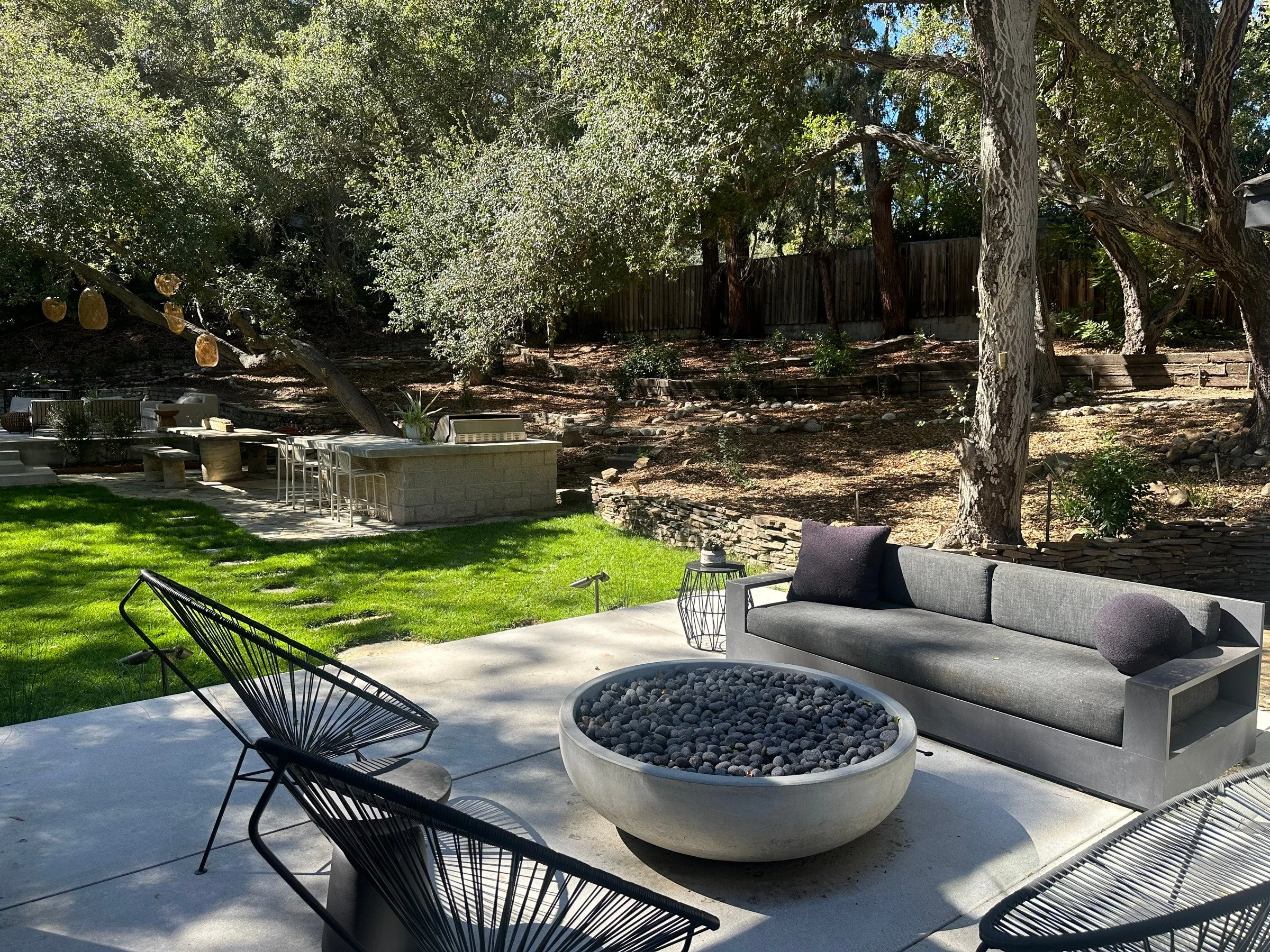 Fire pit lounge on a stone terrace. | PL-3803