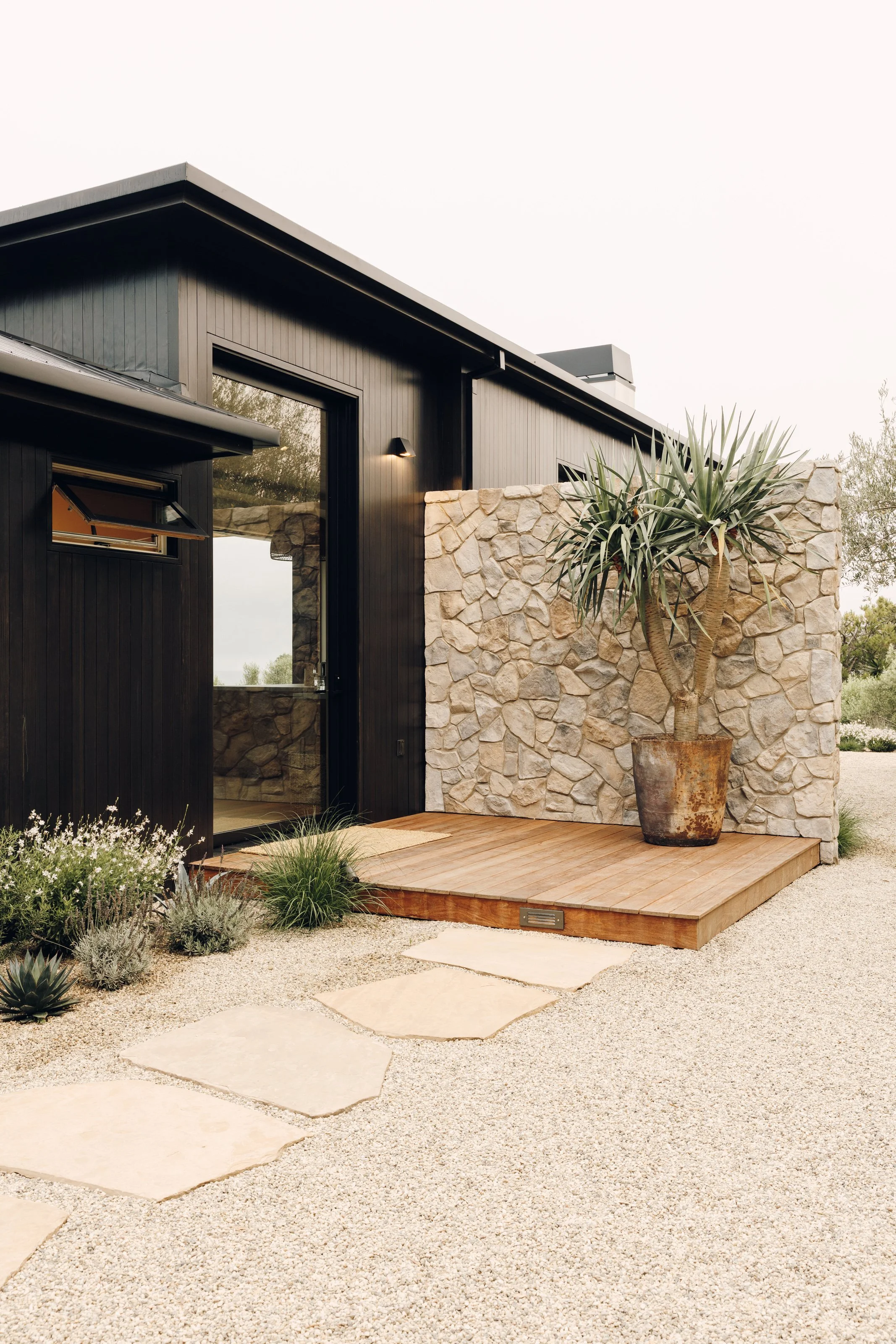 Entry deck and stone privacy wall