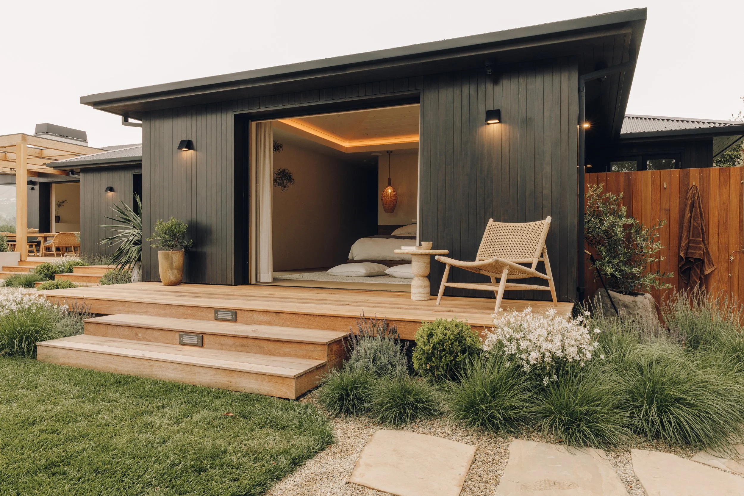 Garden-facing bedroom and deck seating