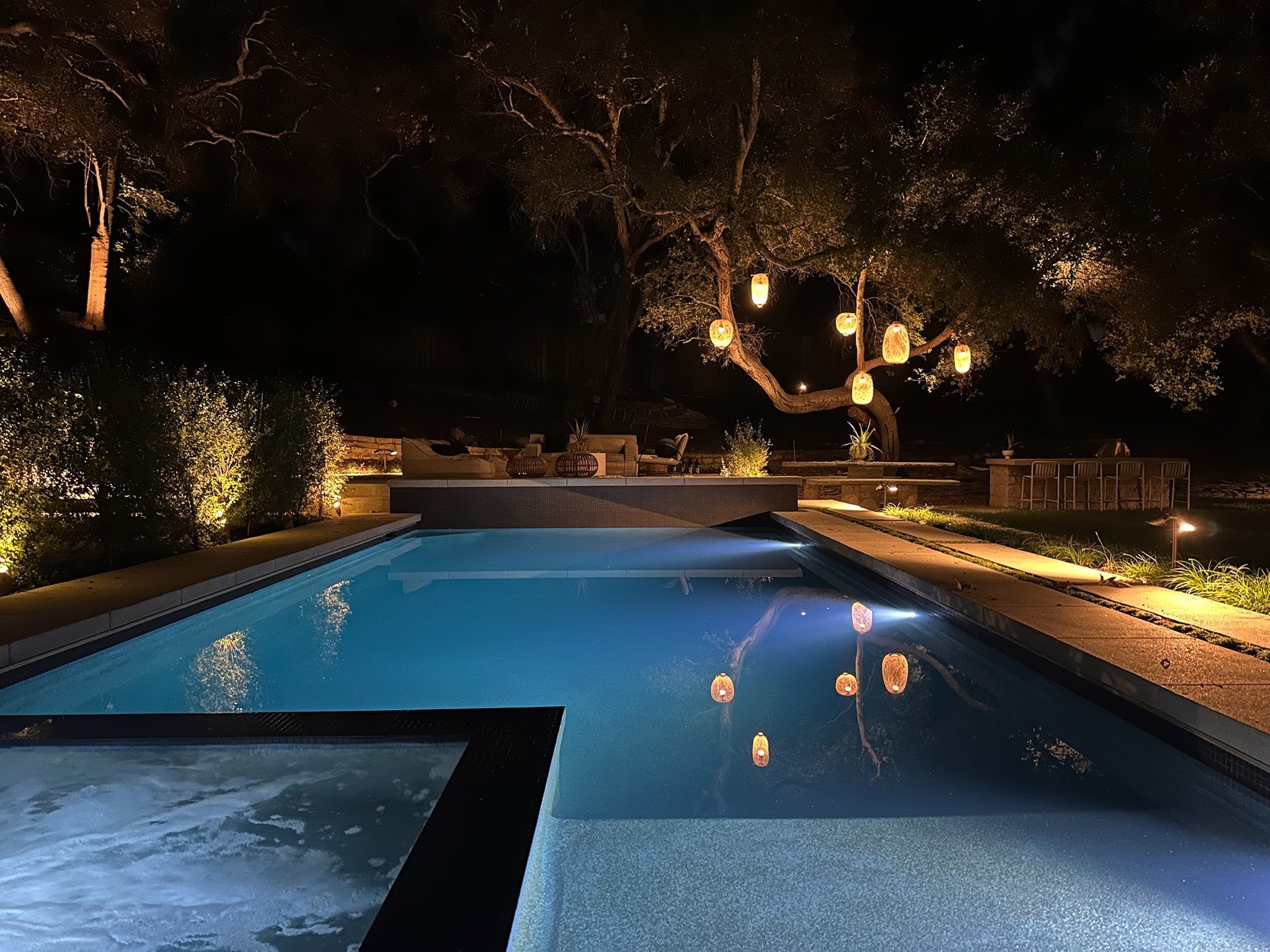 Illuminated pool and spa at night. | PL-3803