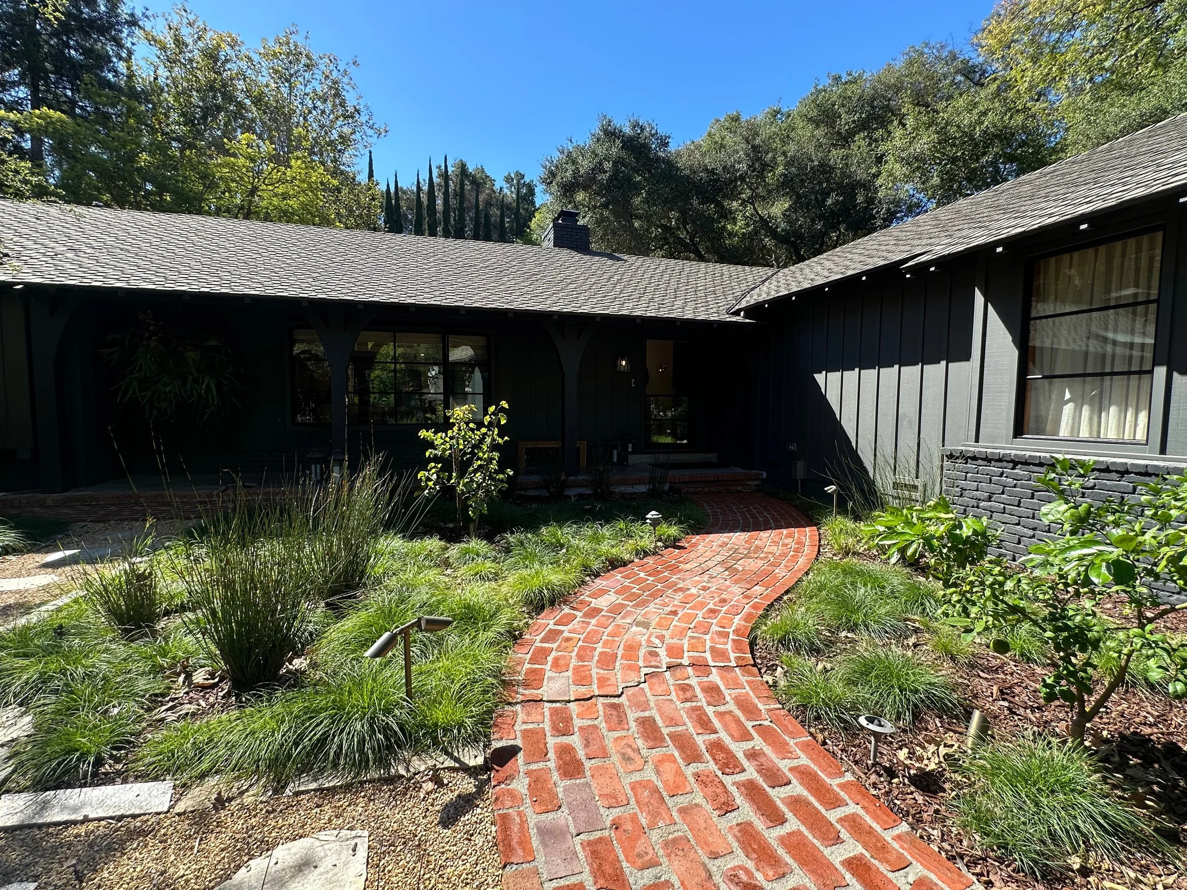 Curved brick walkway leading to the covered front porch. | PL-3803