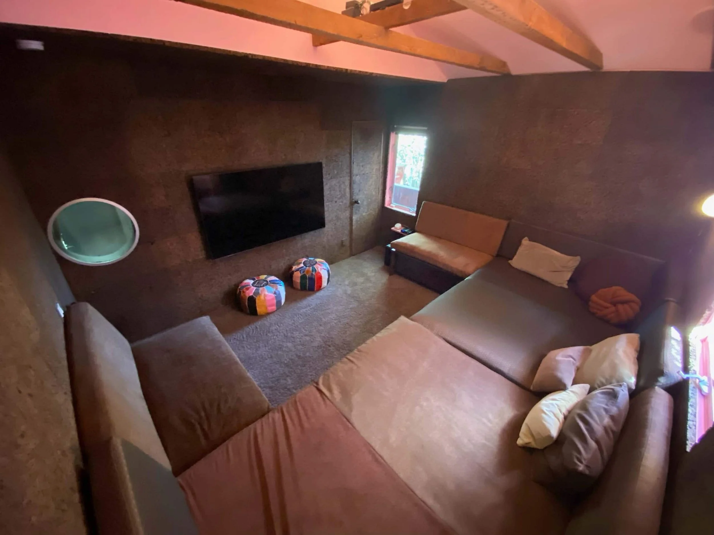 032_Cork_Room_Screen_Room_with_Wrap_Around_Built_in_Sofa_that_Doubles_as_2_Head_to_Head_Q.jpg