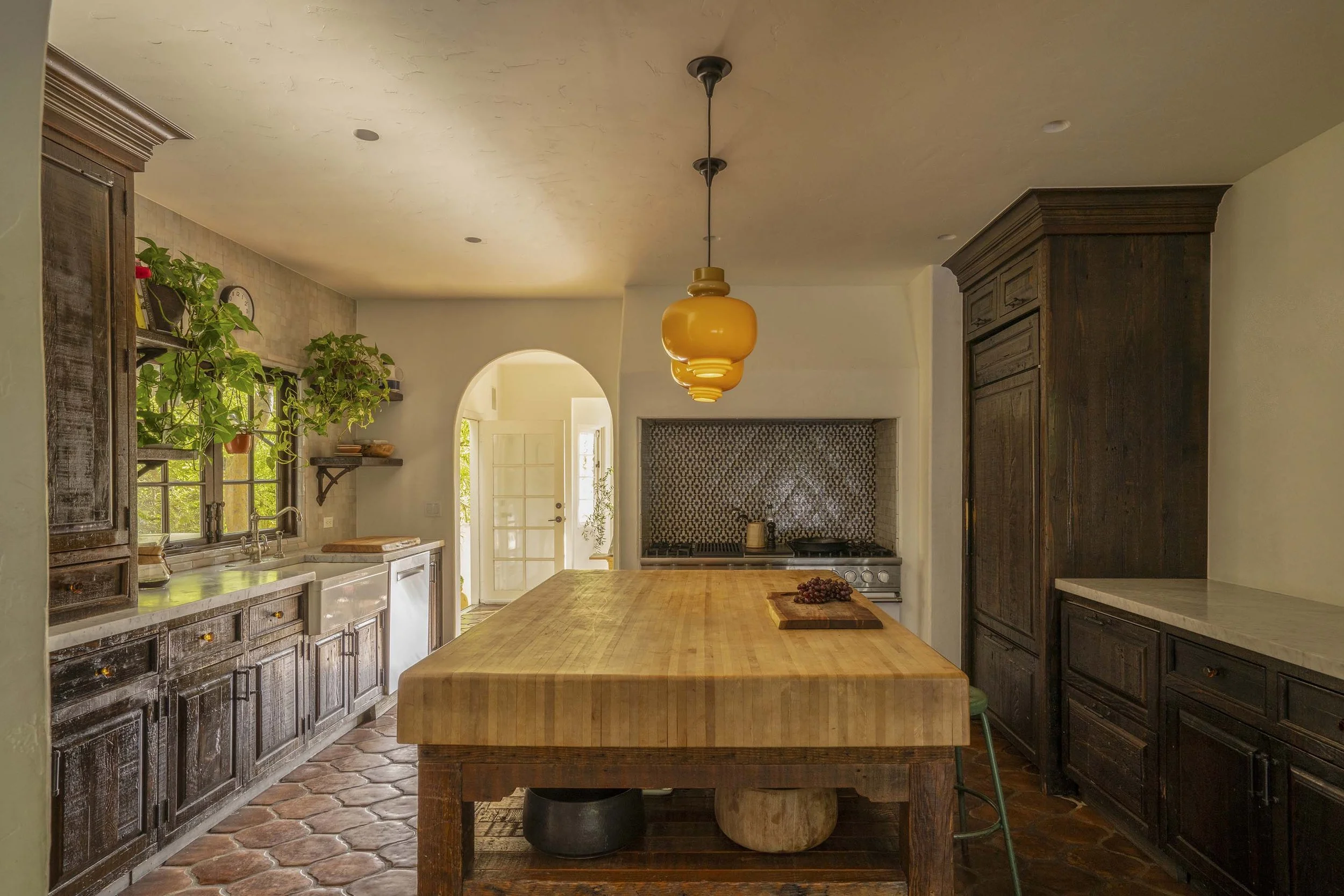 PL6014-021-kitchen-butcher-block-island-amber-pendant-arched-doorway.jpg