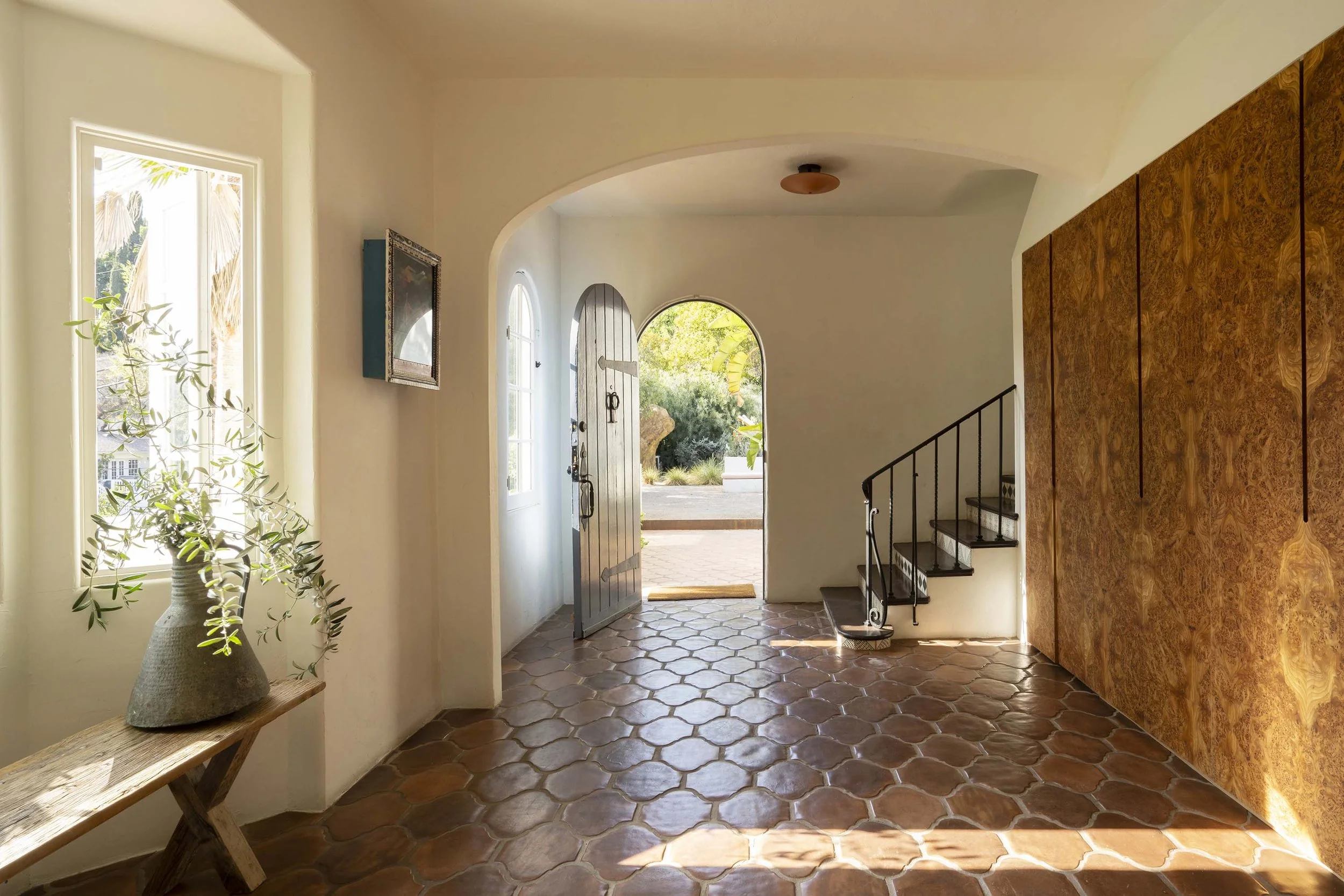PL6014-011-entry-hall-arched-doorway-hex-tile-staircase.jpg