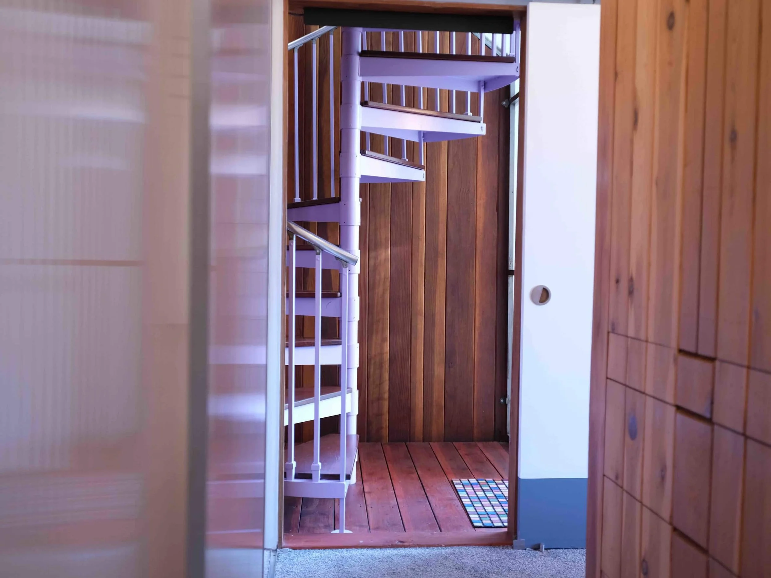 024_Spiral_Staircase_down_to_Primary_Bedroom.jpg