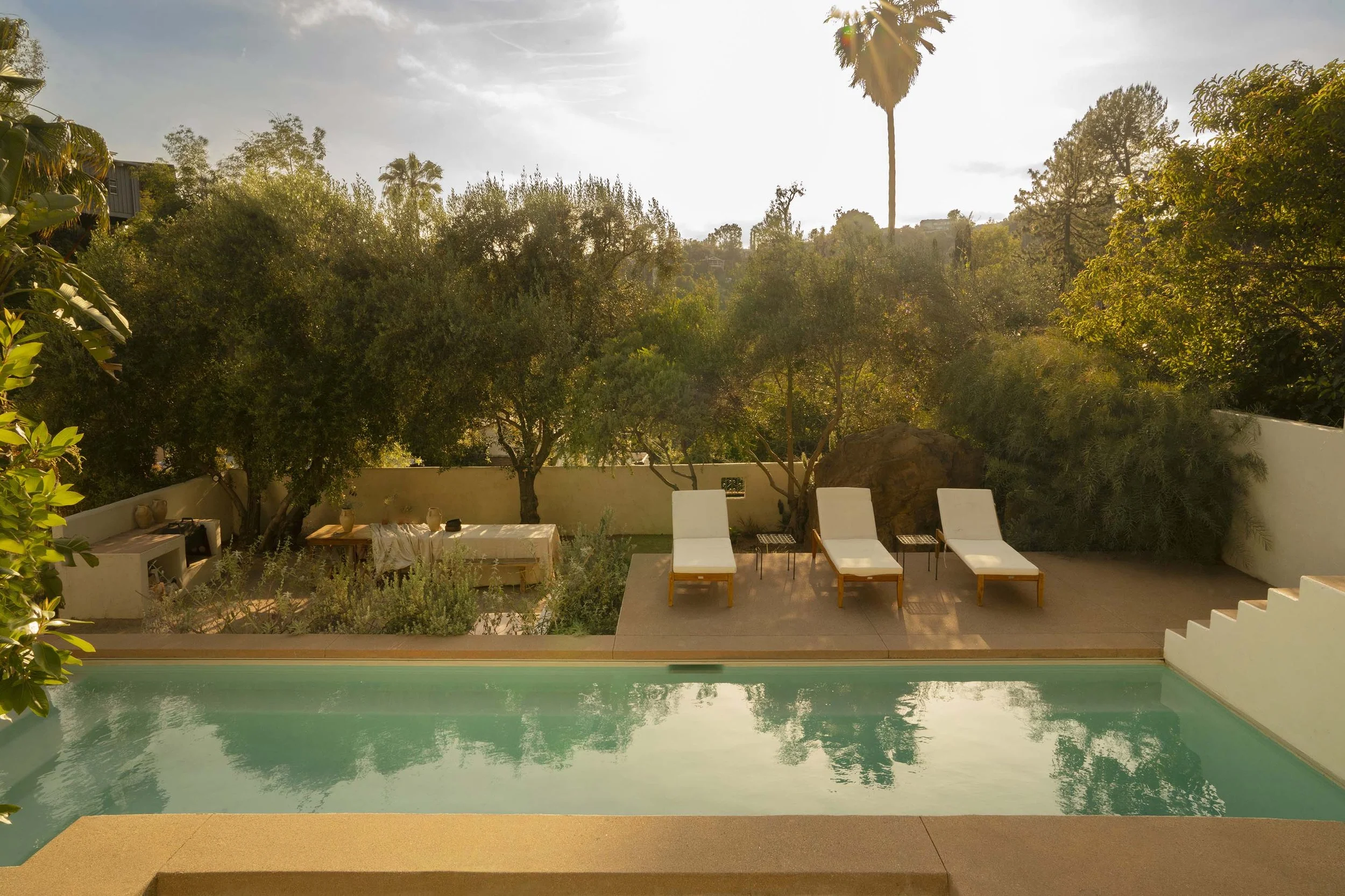 PL6014-038-pool-lounge-chairs-palm-tree-sunset.jpg
