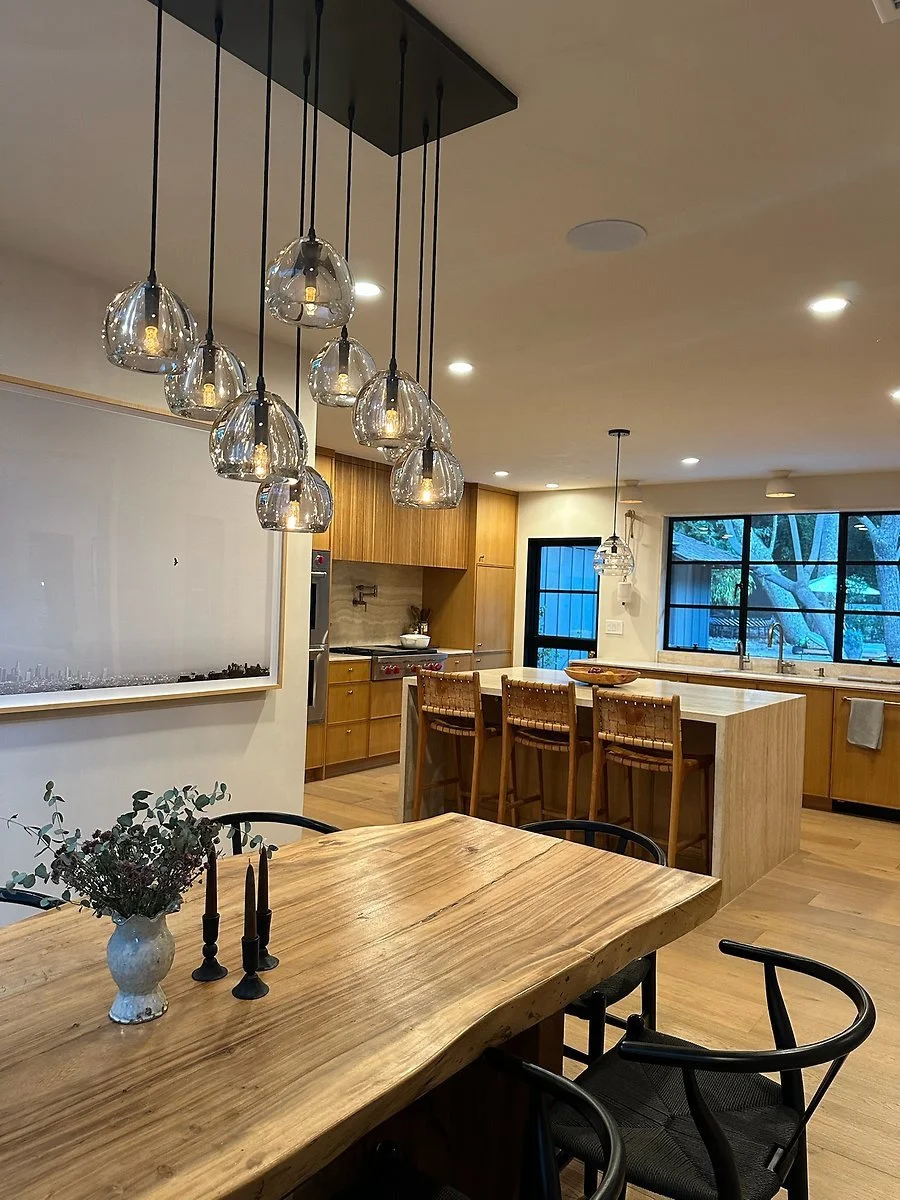 Dining area opening to the kitchen and island. | PL-3803