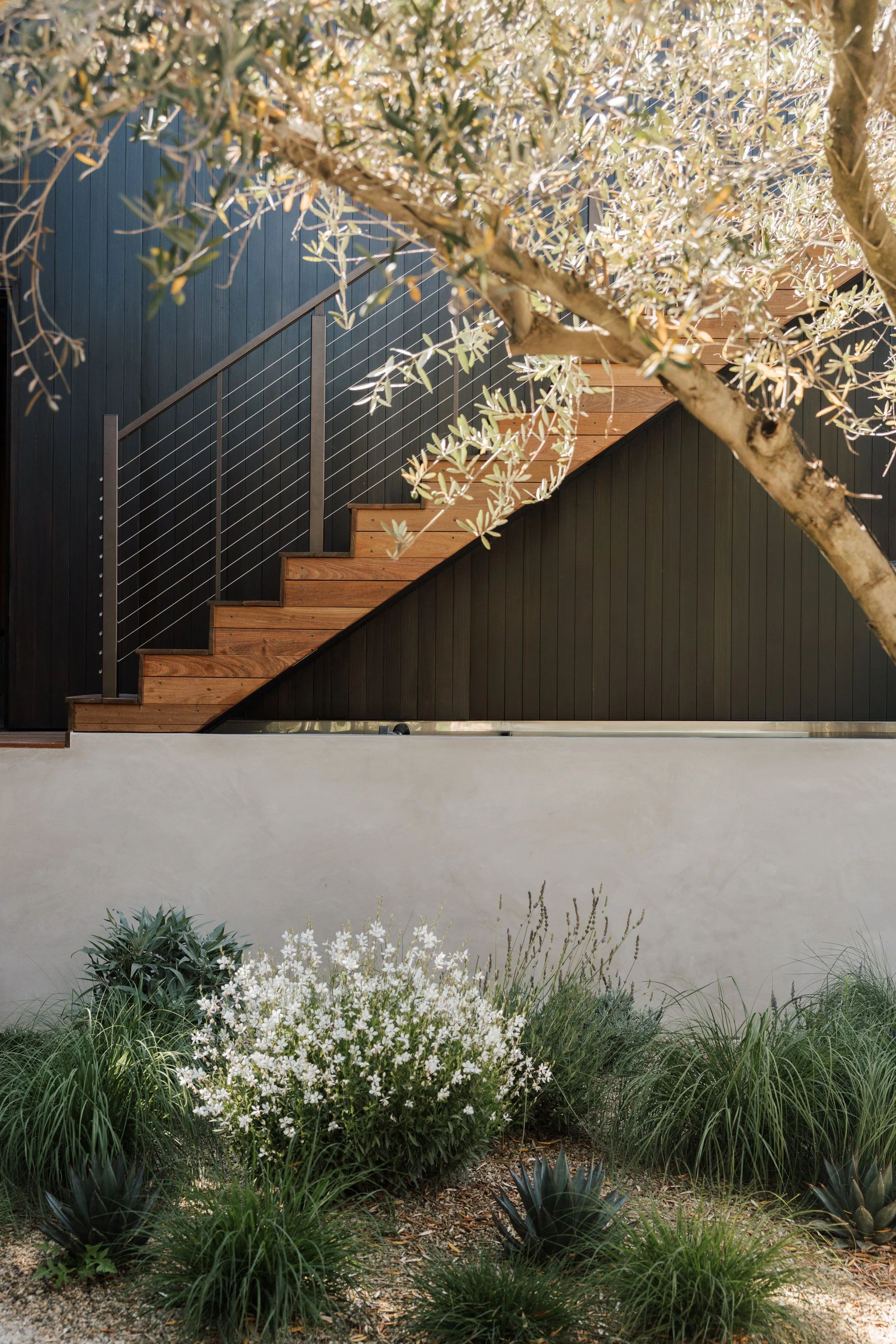 Exterior staircase and landscaped retaining wall