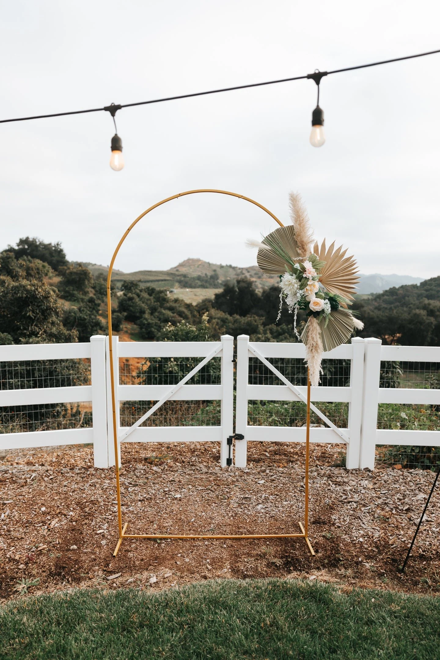 05_Ceremony_Arch_and_White_Fence.jpg