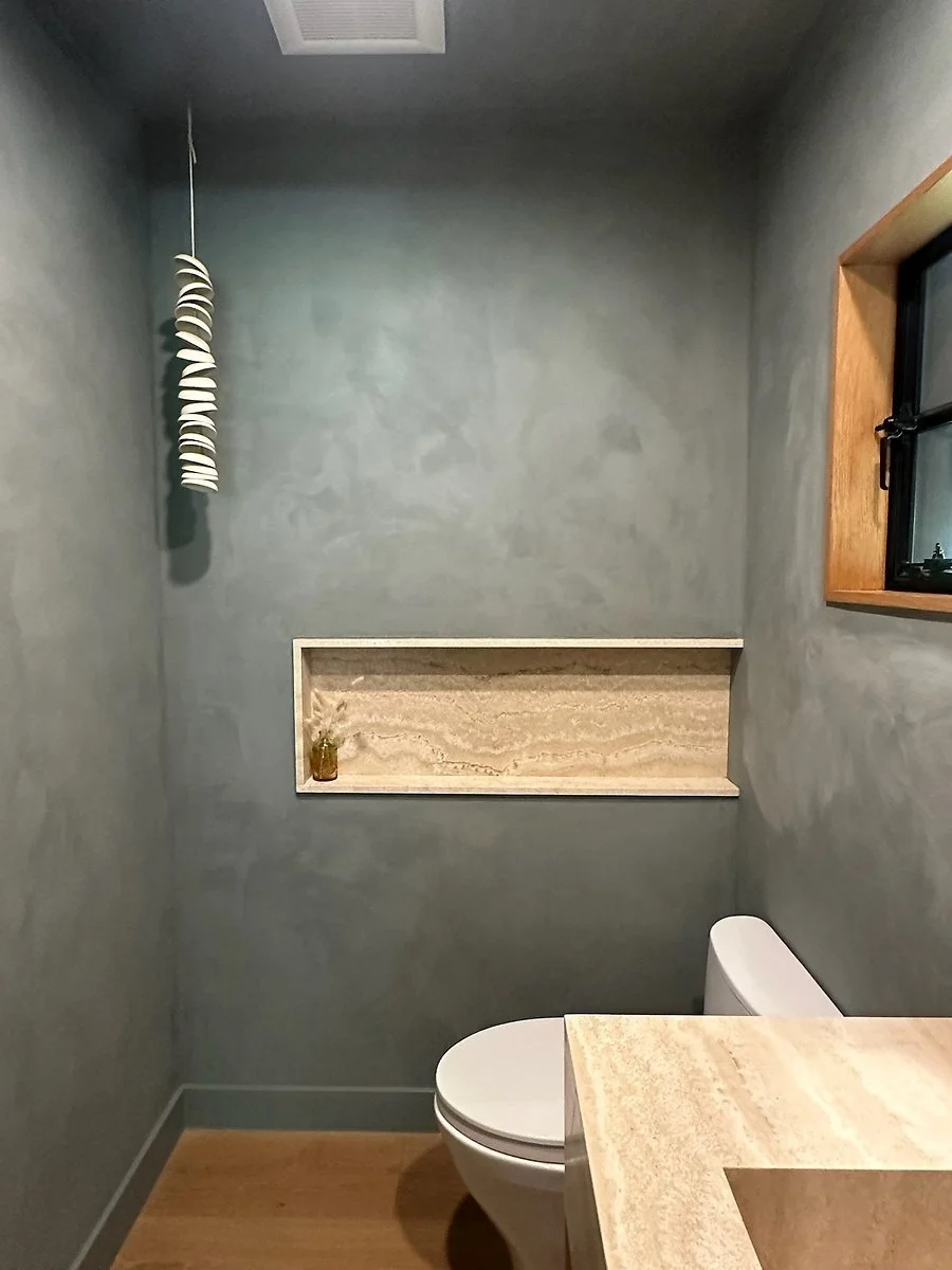 Dark powder room with stone vanity. | PL-3803