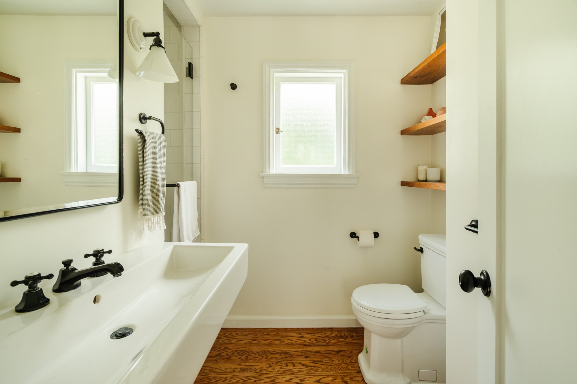 Bathroom — white sink and black fixtures