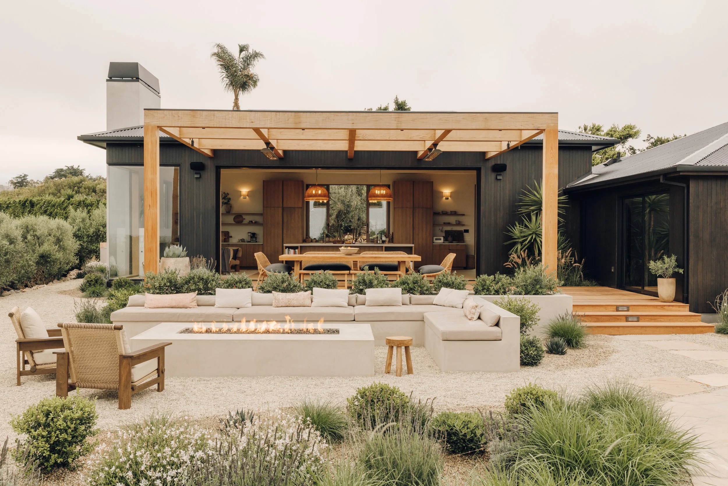 Rear facade and pergola with garden seating