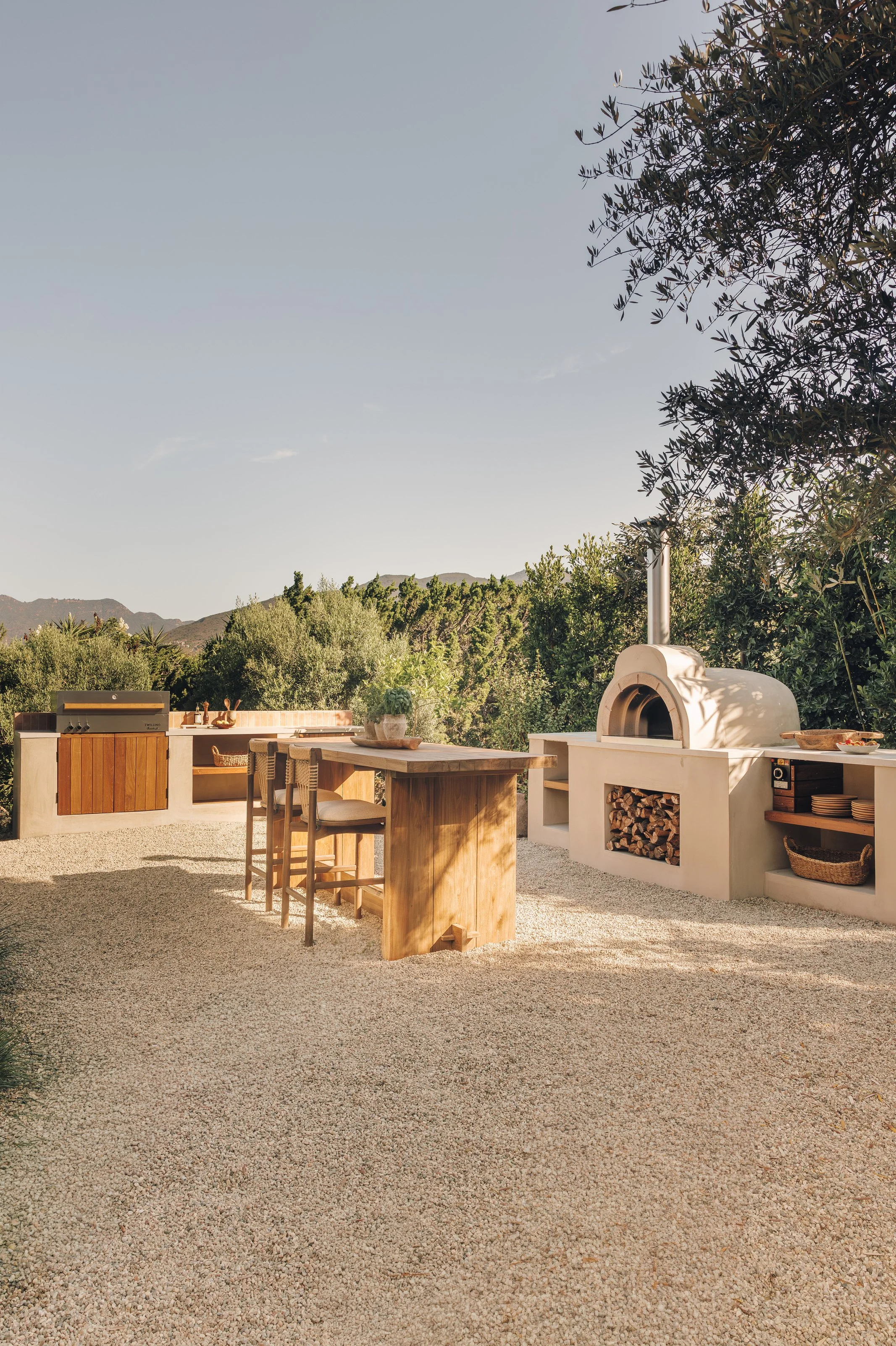 Wide outdoor kitchen and surrounding garden