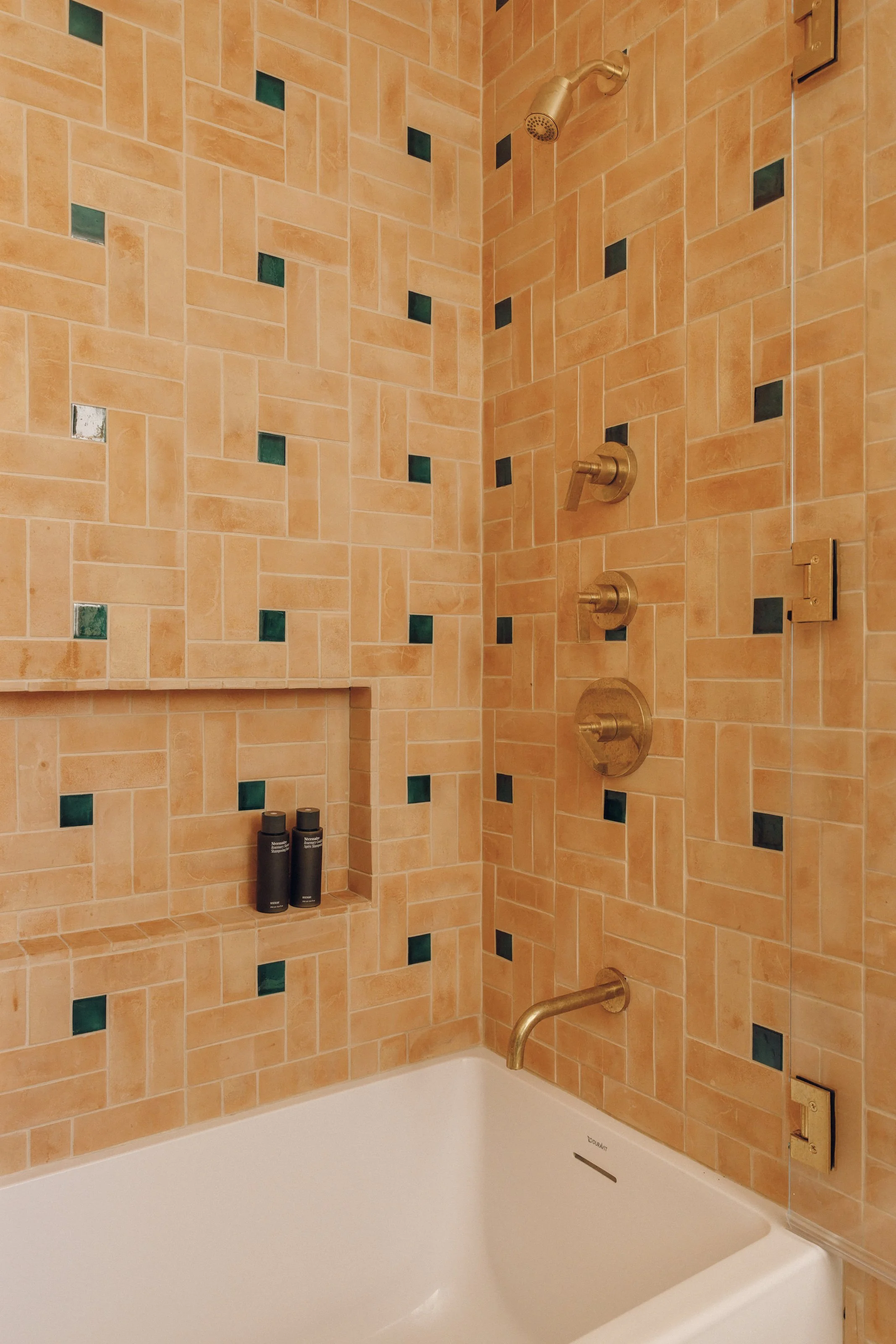 Guest bathroom with tiled tub and shower