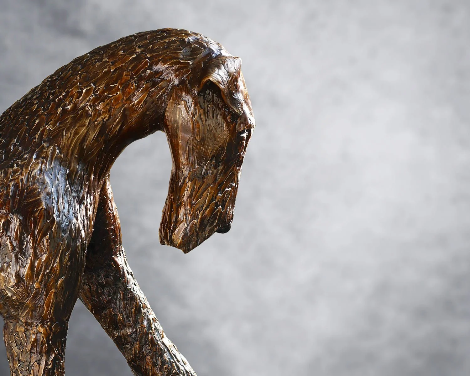 An Airedale Terrier sculpture originally modelled in clay before being cast in bronze using the traditional lost wax process.