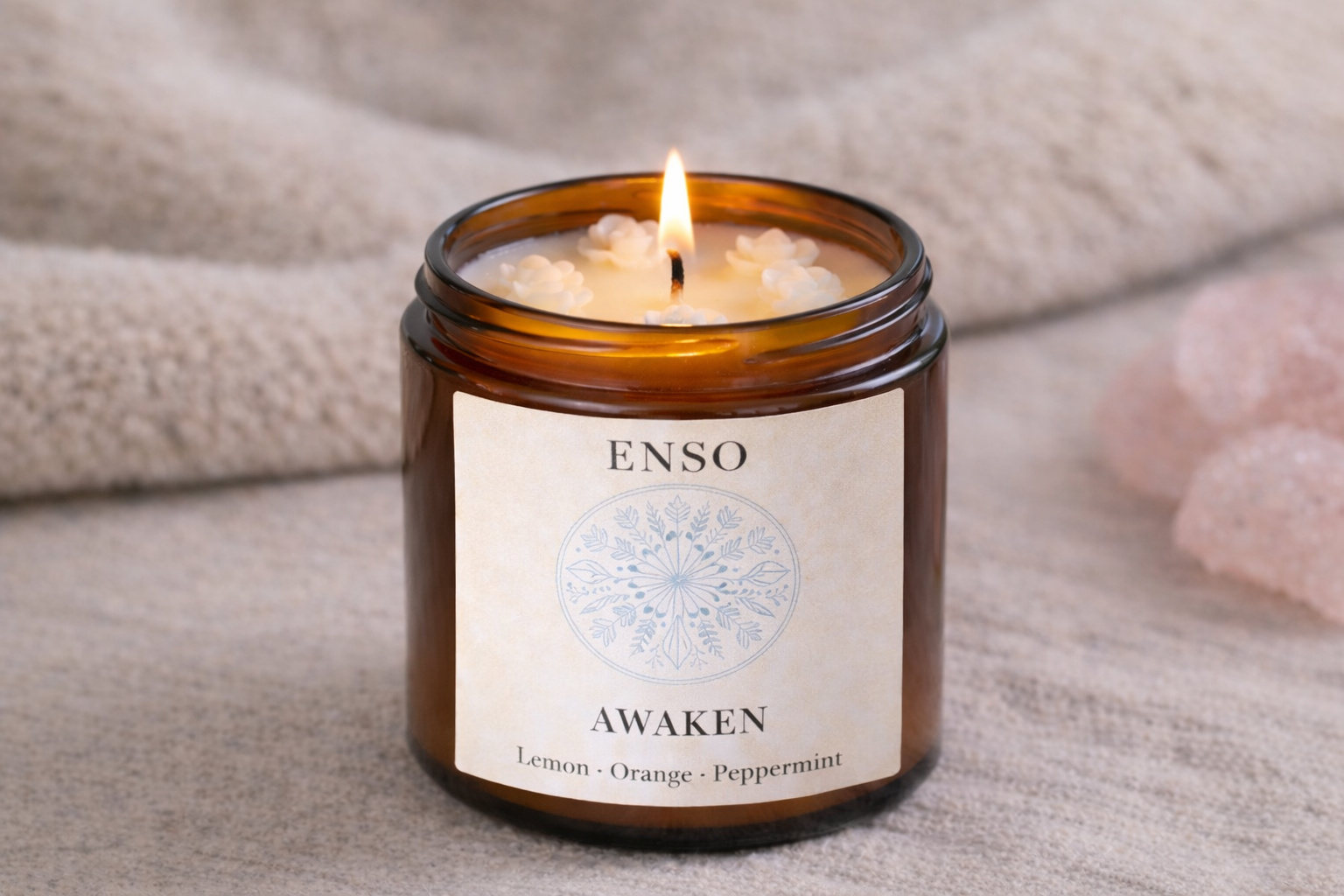 Glowing ENSO candle with floral details.png