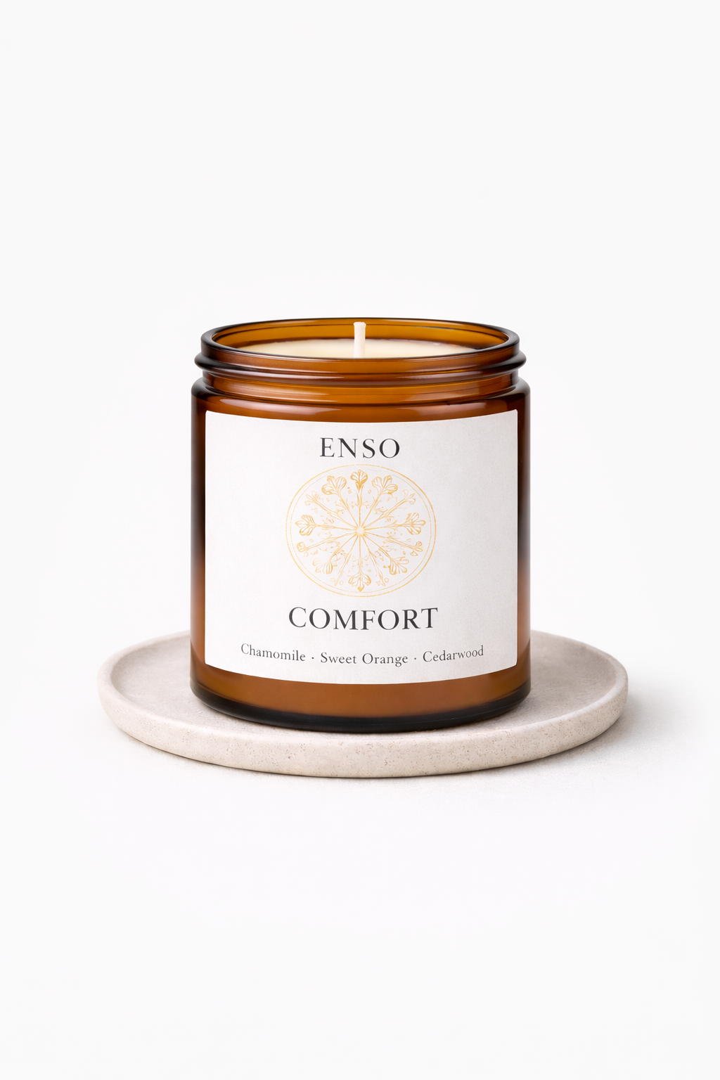ENSO Comfort candle on ceramic coaster.png