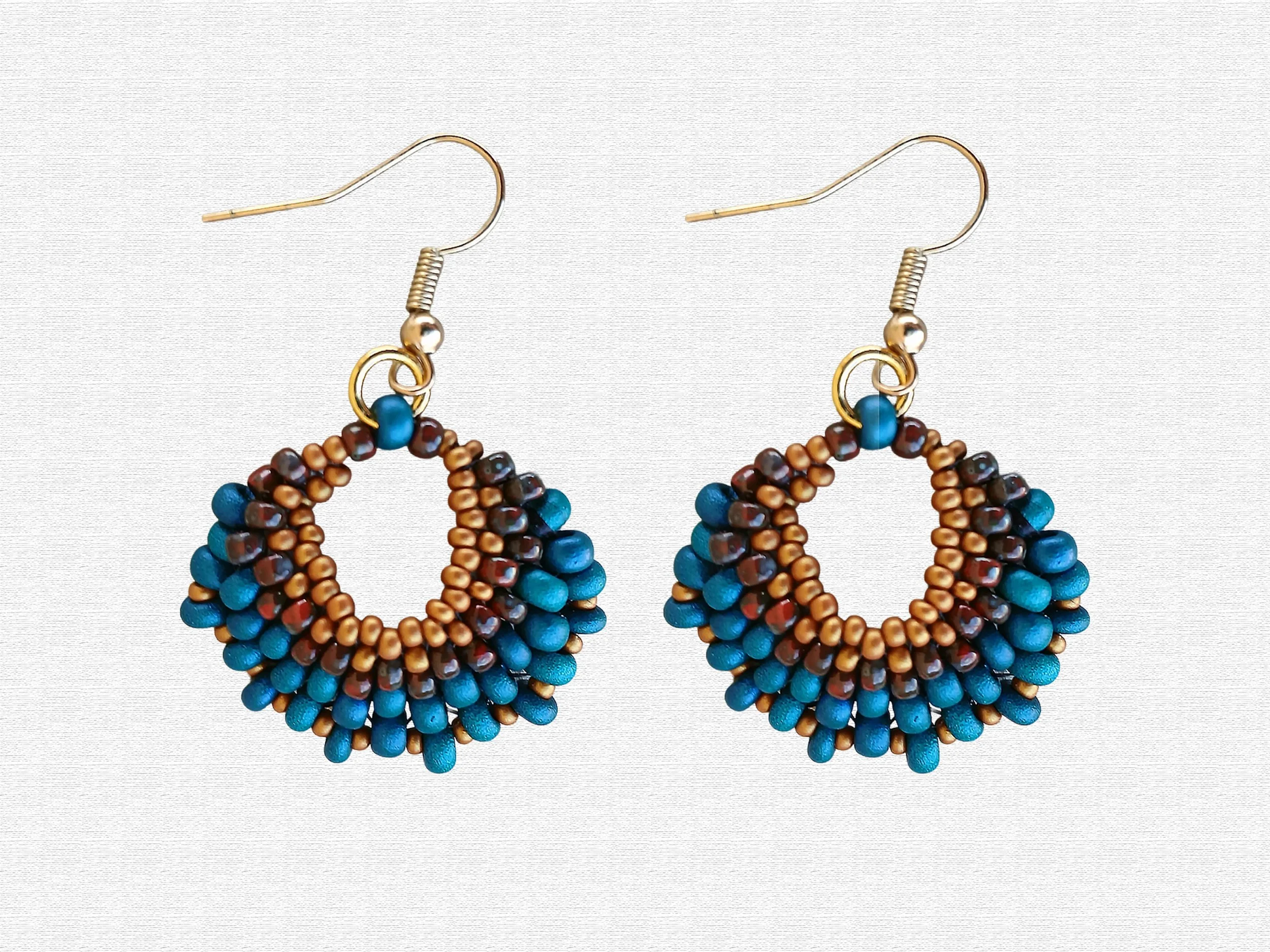 Handmade peacock oval lightweight peyote stitch dangle earrings featuring a seed bead pattern in brown and blue