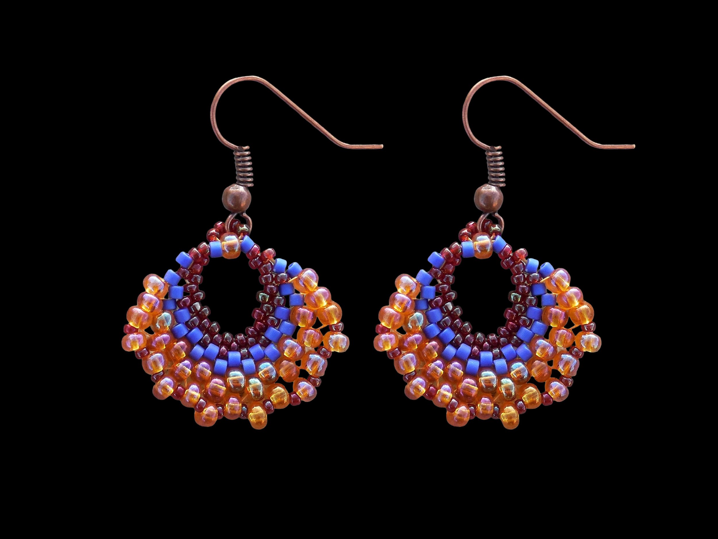 Handmade crescent fan dangle earrings handwoven in red, cobalt blue and orange luster glass seed beads using peyote stitch.