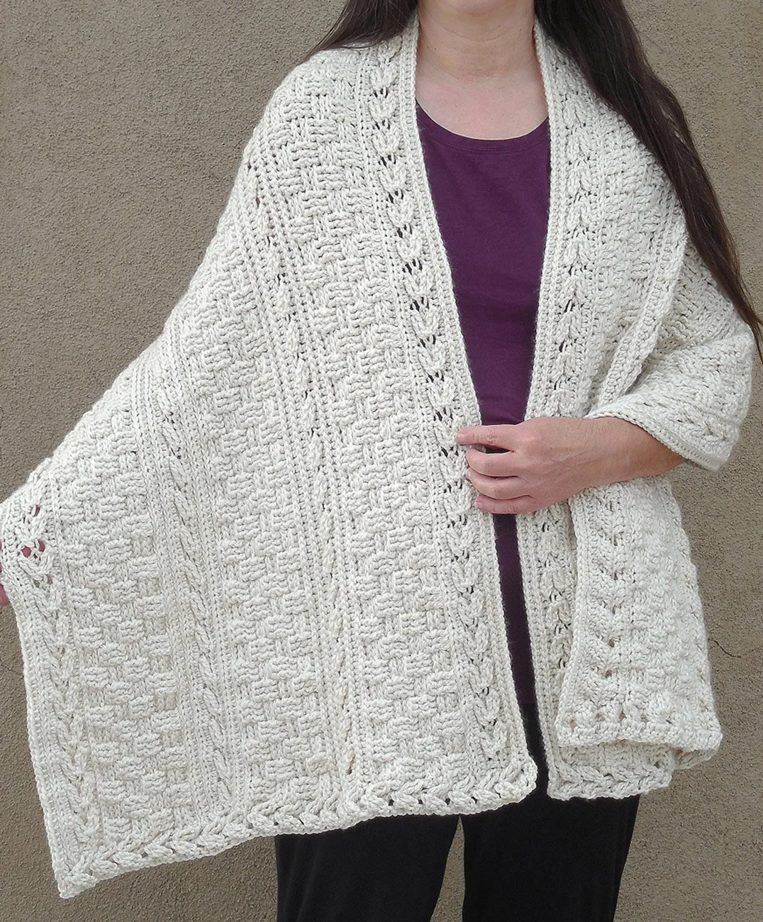 Free crochet Celtic shawl pattern by designer Robin Harley, featuring textured cable arrows and open panel view.