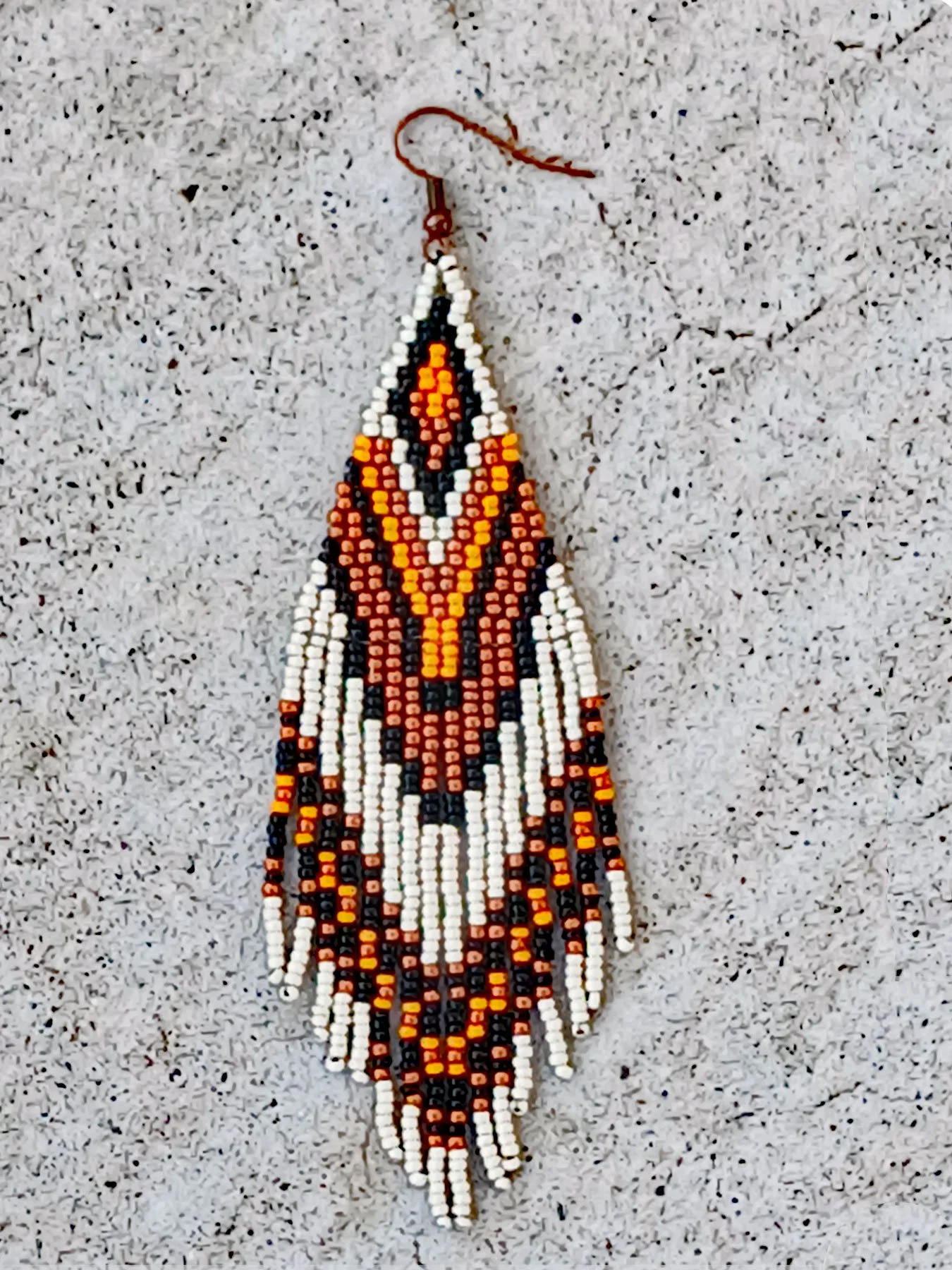 Handmade 5" sunset orange and black beaded fringe earrings handwoven with accents of rich copper, and matte silver beads.