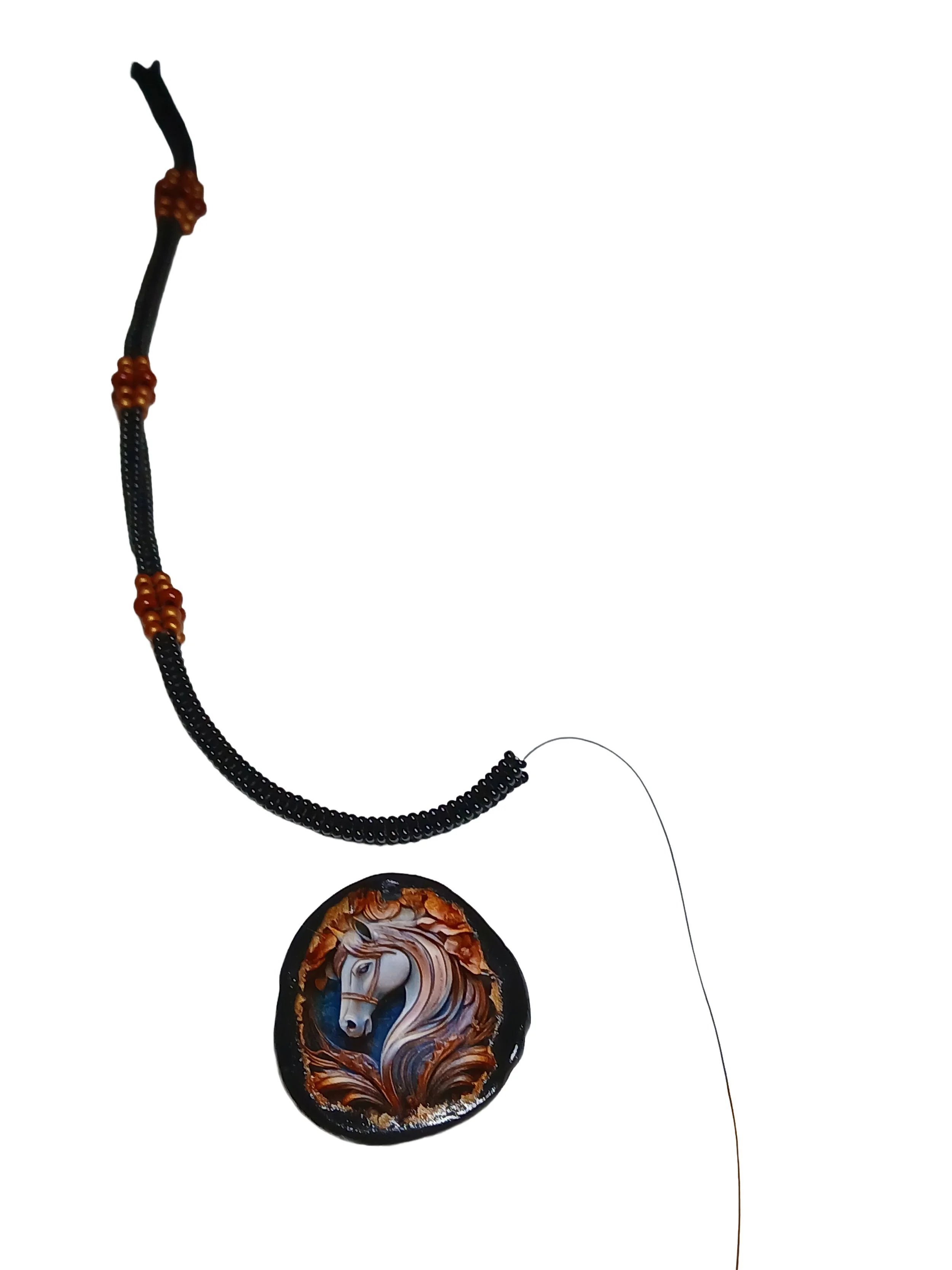 Handmade black herringbone beaded rope necklace with hand-woven copper accents and a non-metal, all-bead toggle closure.