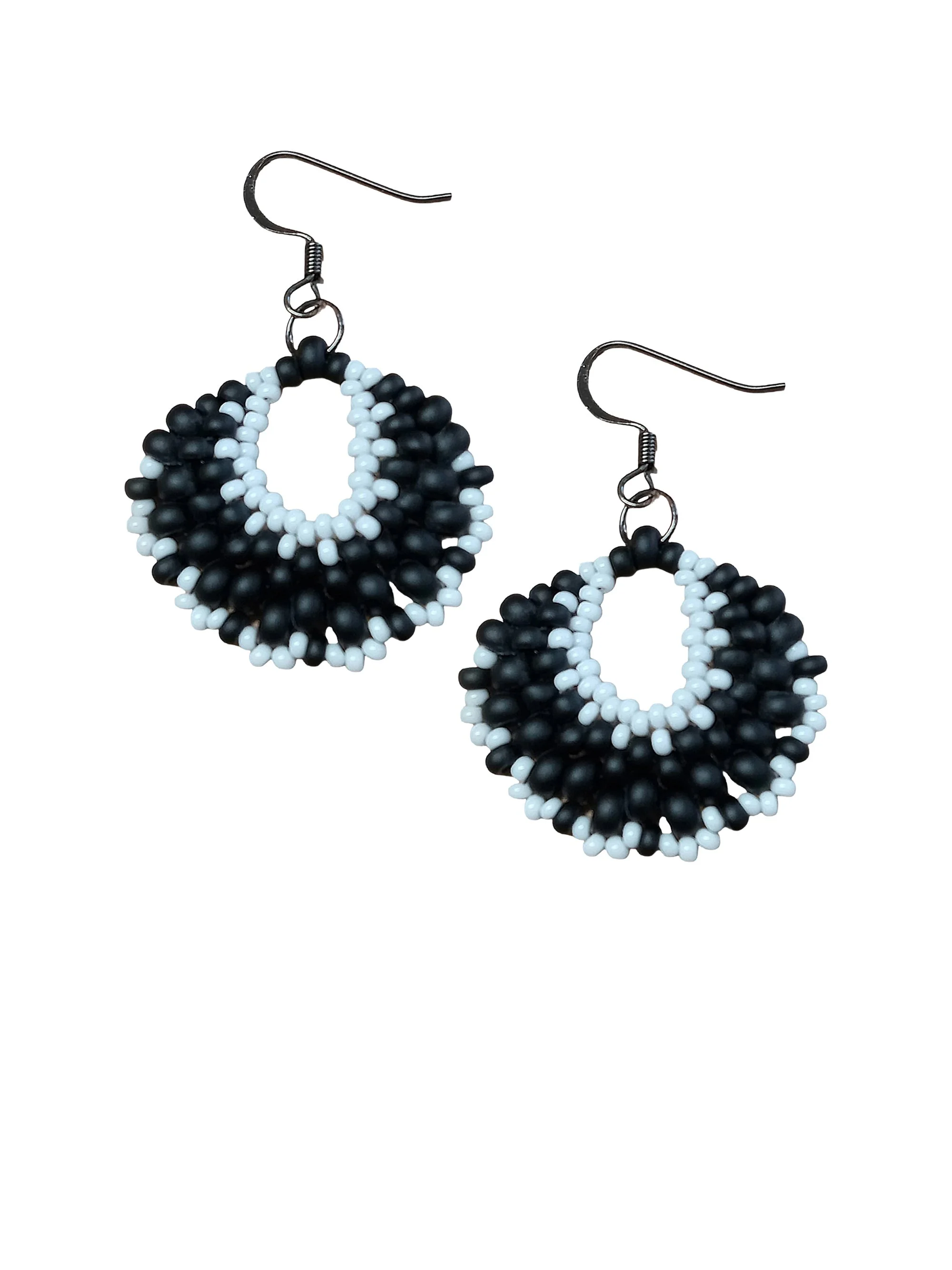 Handmade classic beaded crescent dangle earrings handwoven in black and white glass seed beads using peyote stitch.