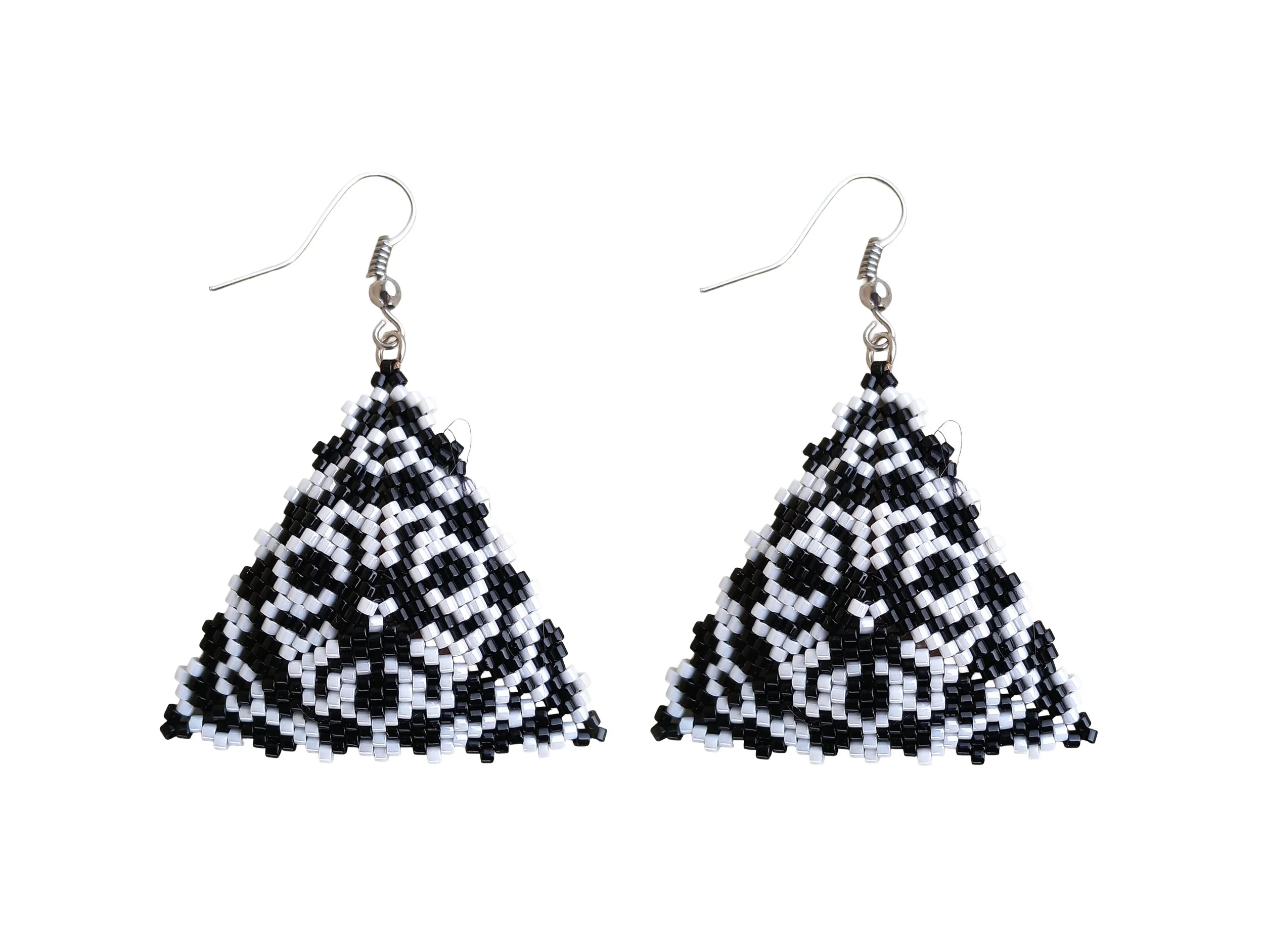 Handmade lightweight beaded abstract lion face statement earrings in a black and white geometric peyote triangle style