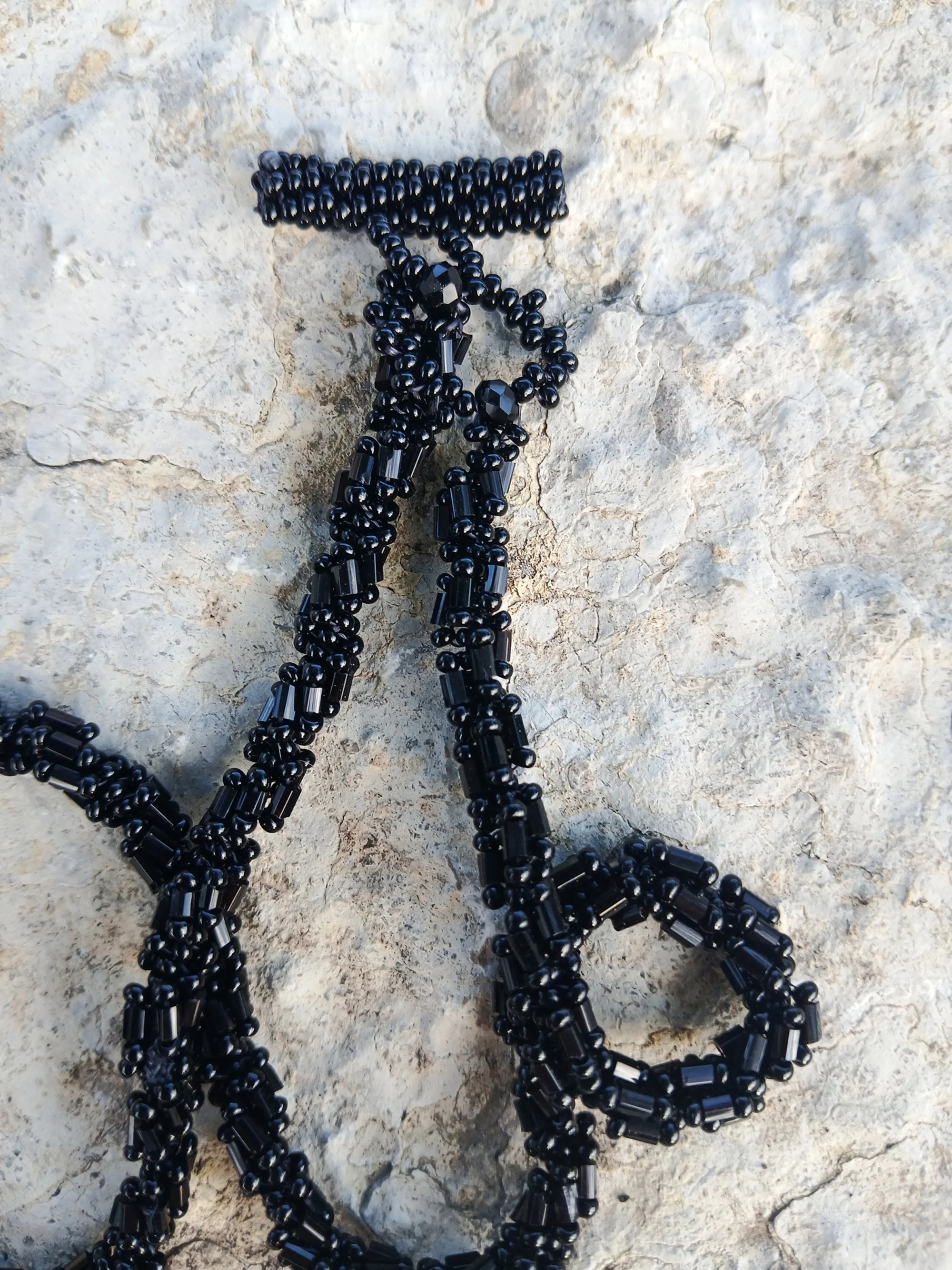 Handmade vintage style necklace with a faceted black Rivoli crystal cabochon and detailed hex bugle and small seed beads