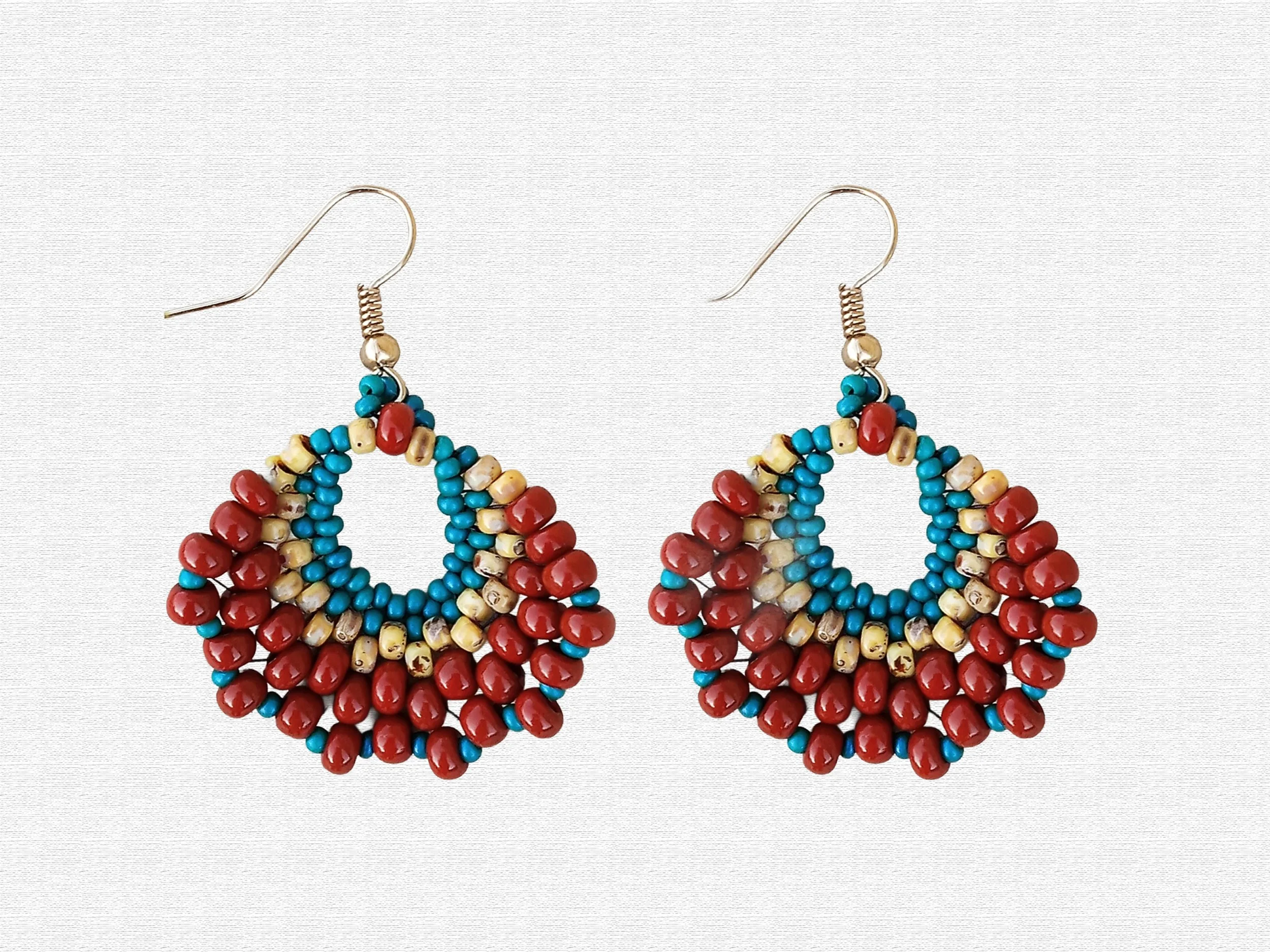 Handmade oval lightweight peyote stitch dangle earrings featuring a seed bead pattern in brown tan and blue