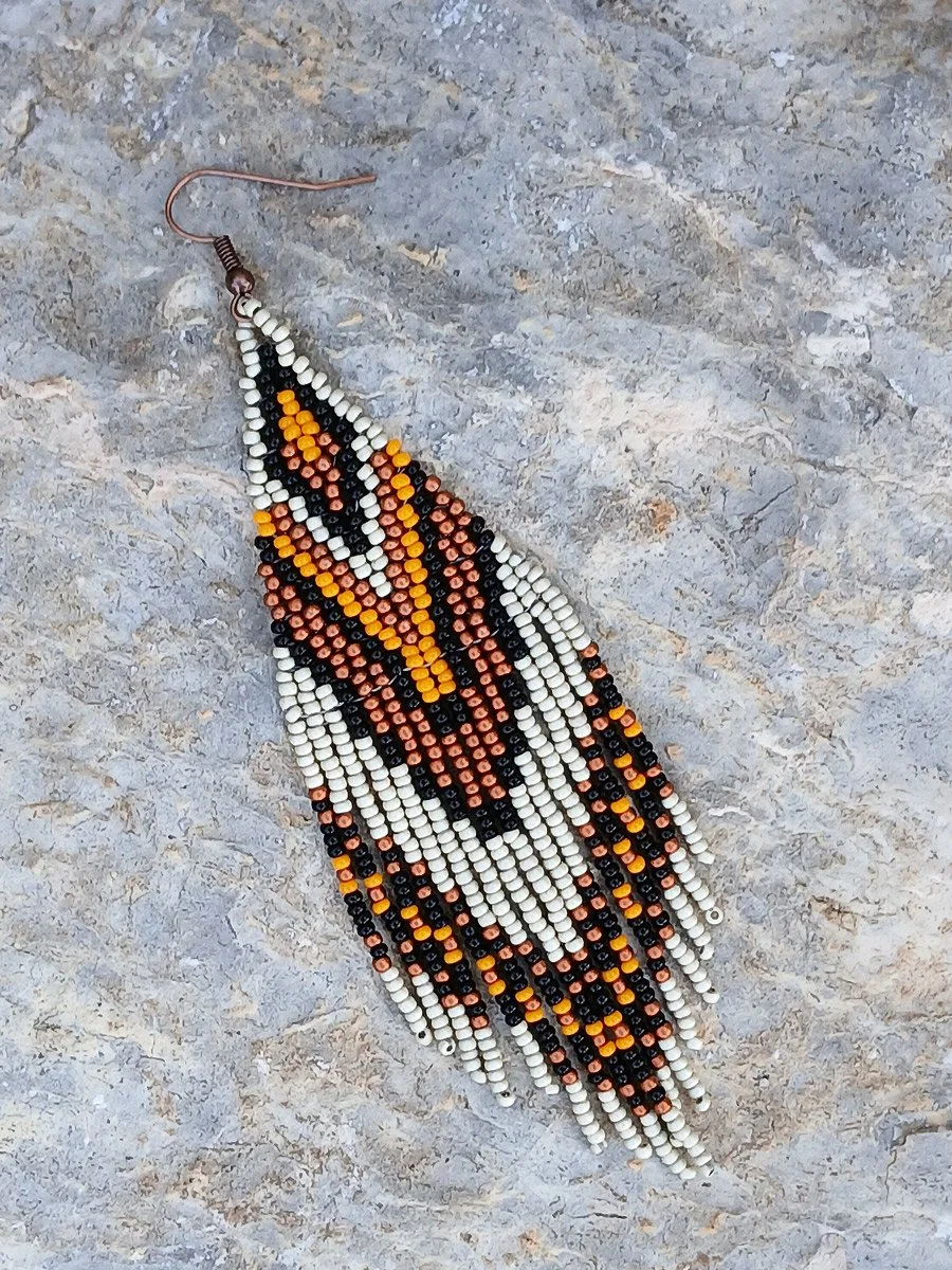 Handmade 5" sunset orange and black beaded fringe earrings handwoven with accents of rich copper, and matte silver beads.