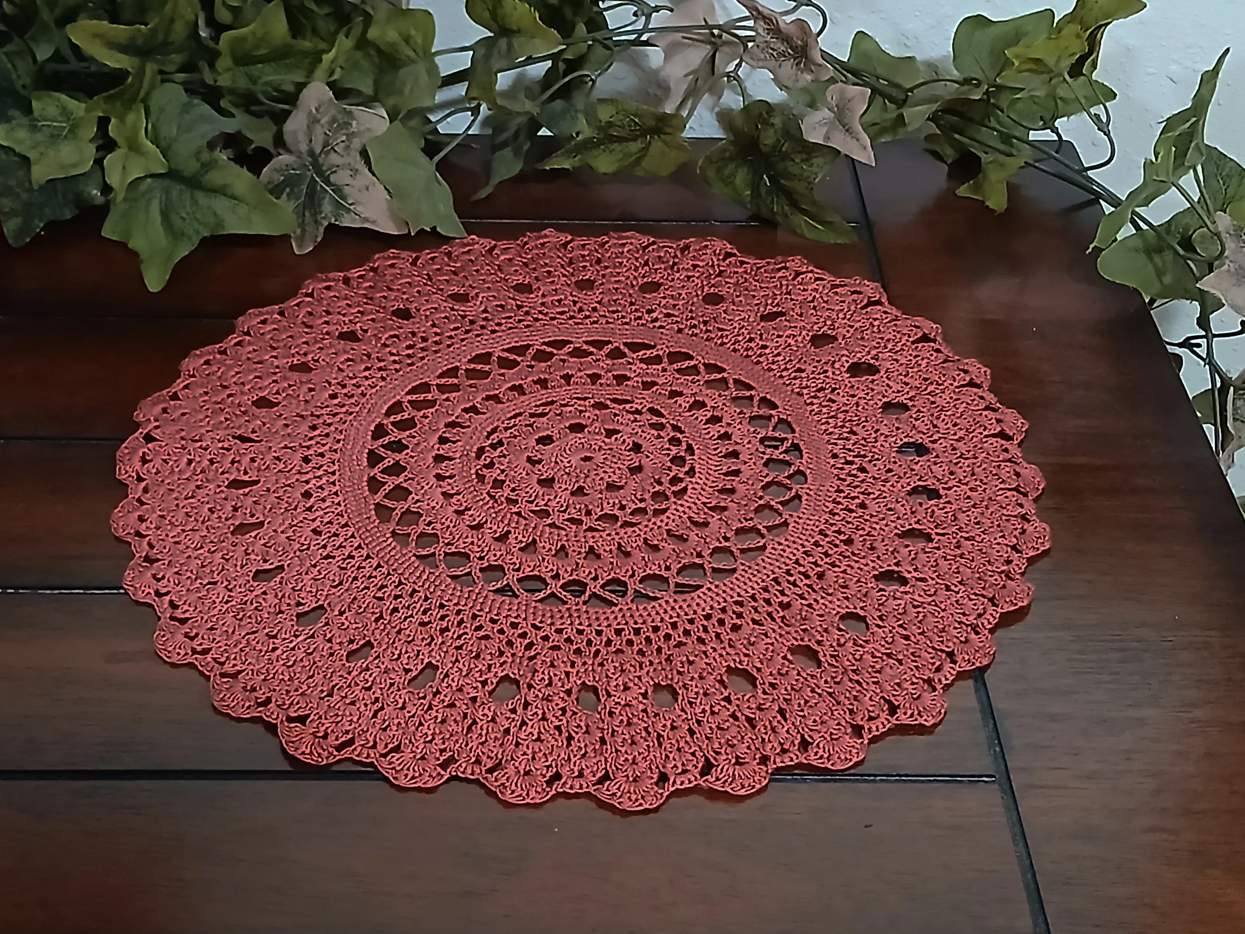Handmade 12 inch crochet round lace doily in deep rust color, featuring intricate traditional pattern 100% mercerized cotton