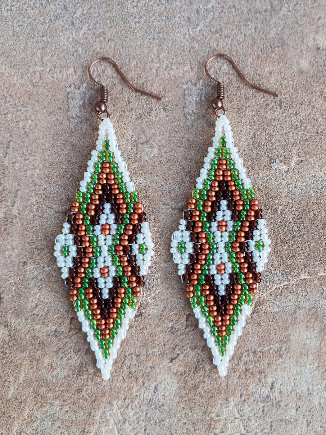Copper Meridian drop beaded earrings featuring an oblong geometric design