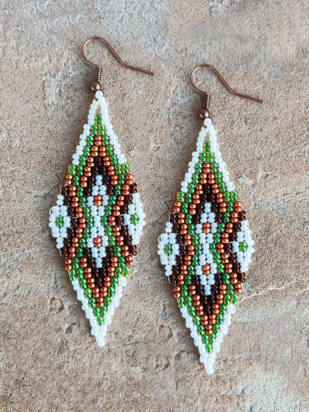 Copper Meridian drop beaded earrings featuring an oblong geometric design