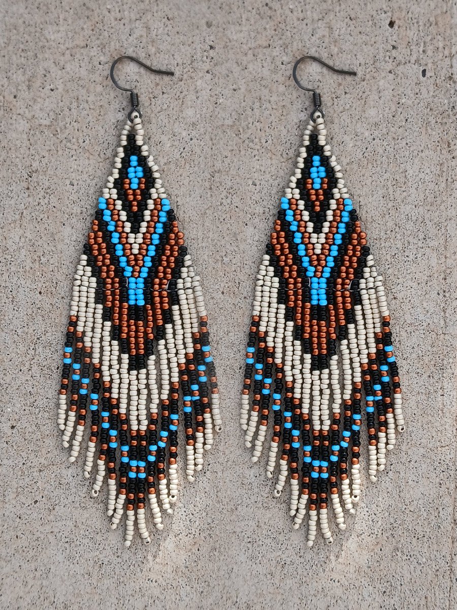 Handmade precision long fringe earrings handwoven Preciosa Czech glass beads in sky blue, matte silver, black, and copper tones.