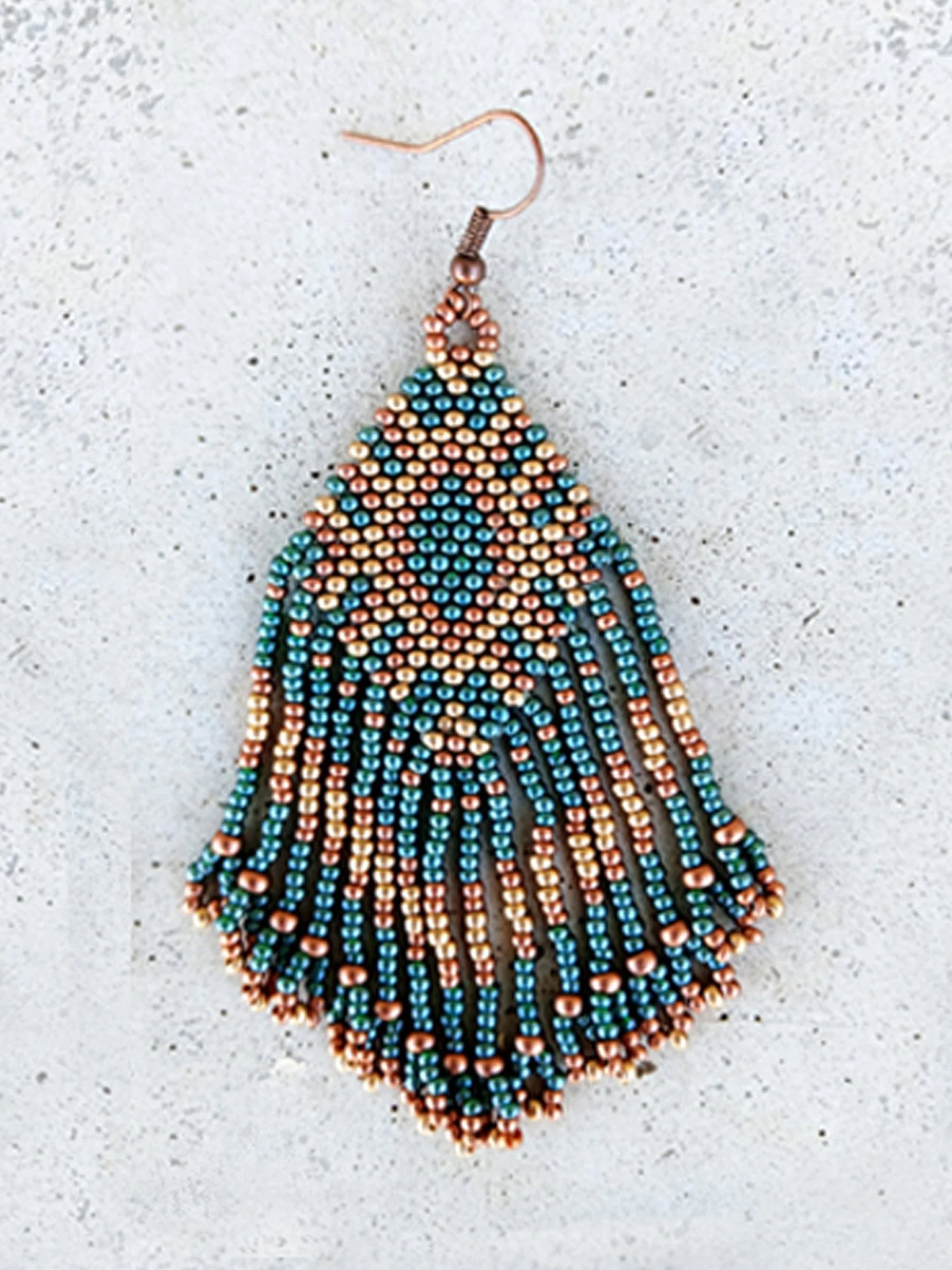 Handmade Southwestern beaded fringe dangle earrings handwoven in an earthy green, metallic gold, and copper color palette.