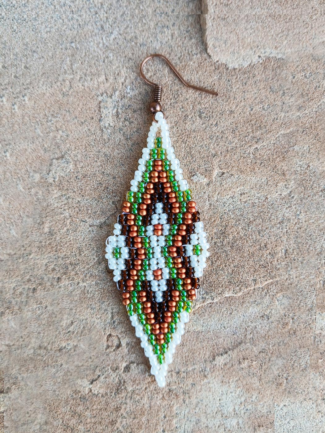 Copper Meridian drop beaded earrings featuring an oblong geometric design