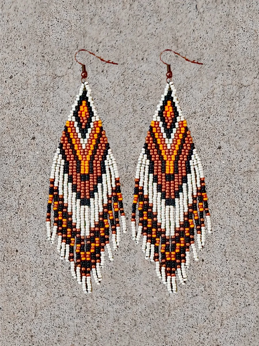 Handmade 5" sunset orange and black beaded fringe earrings handwoven with accents of rich copper, and matte silver beads.