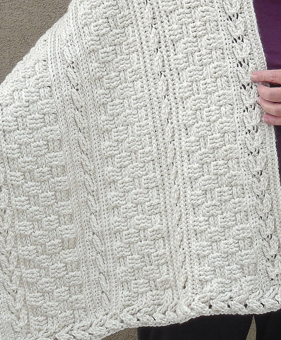 Free crochet Celtic shawl pattern by designer Robin Harley, featuring textured cable arrows in closeup view.