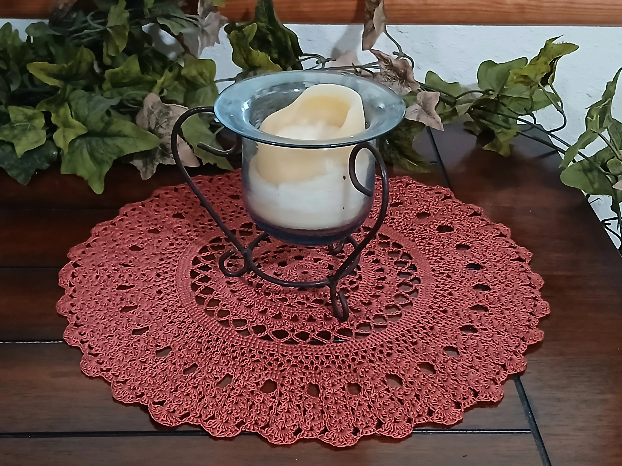 Handmade 12 inch crochet round lace doily in deep rust color, featuring intricate traditional pattern 100% mercerized cotton