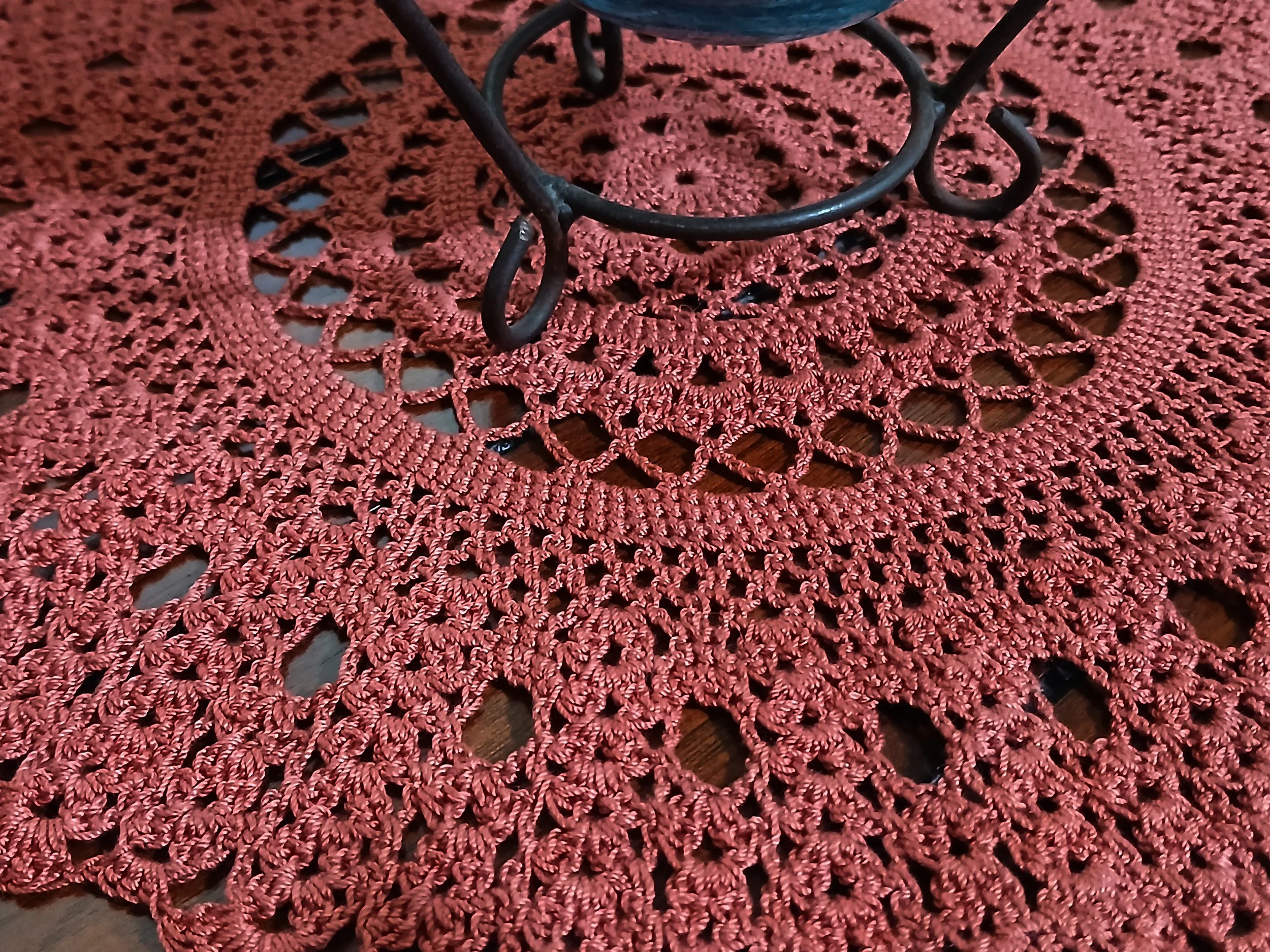 Handmade 12 inch crochet round lace doily in deep rust color, featuring intricate traditional pattern 100% mercerized cotton