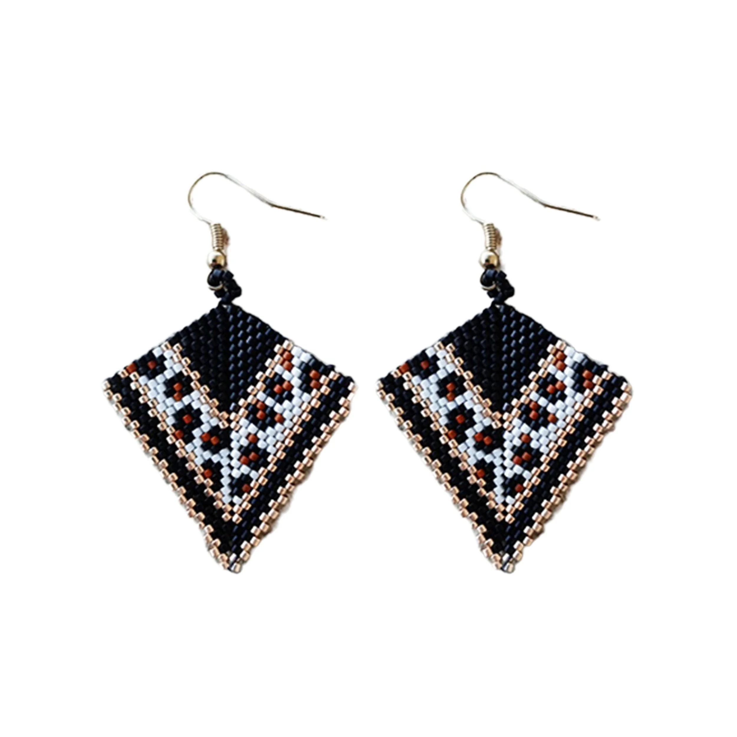 Handmade geometric arrow-shaped beaded earrings in peyote stitch and handwoven in a chic animal print jaguar pattern with metallic gold accents.