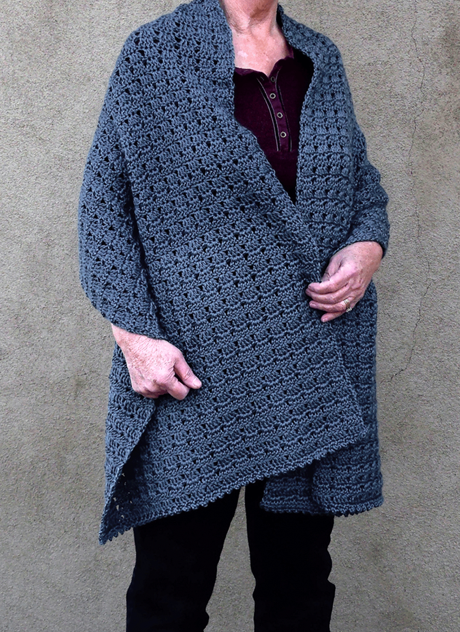 Free rectangle crochet shawl pattern made with Caron Simply Soft yarn, draped over a person's shoulders.
